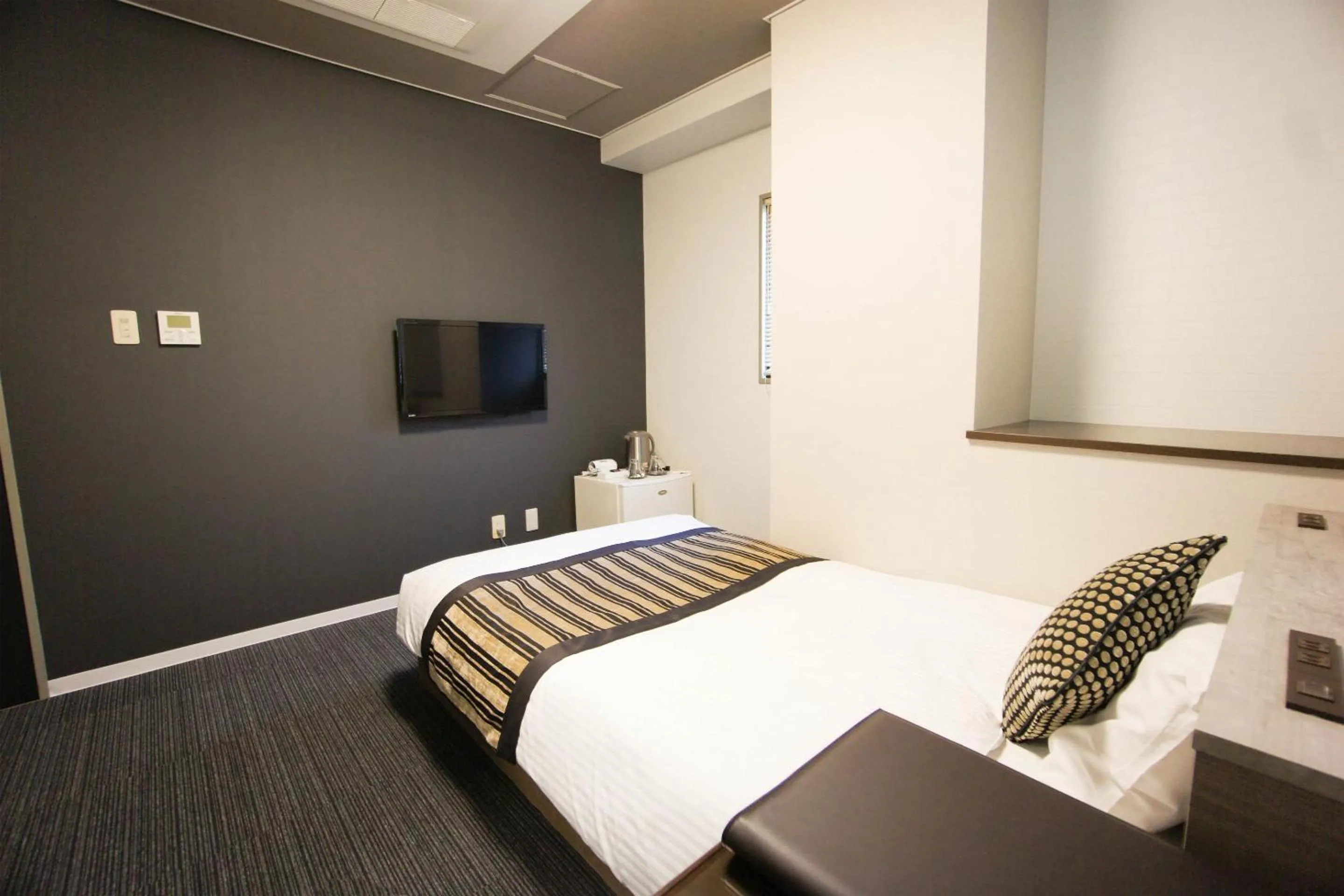 Bed in Hotel AreaOne Nobeoka