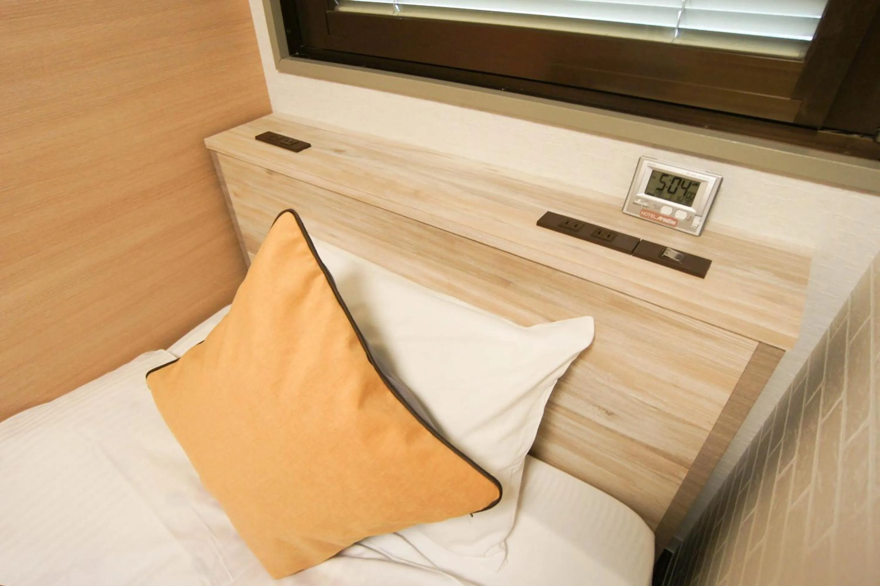 Bed in Hotel AreaOne Nobeoka