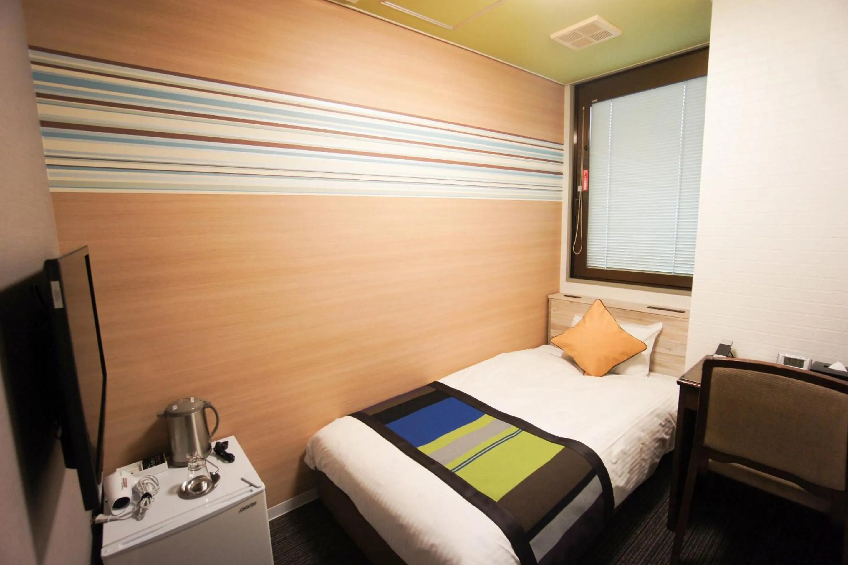 Bed in Hotel AreaOne Nobeoka