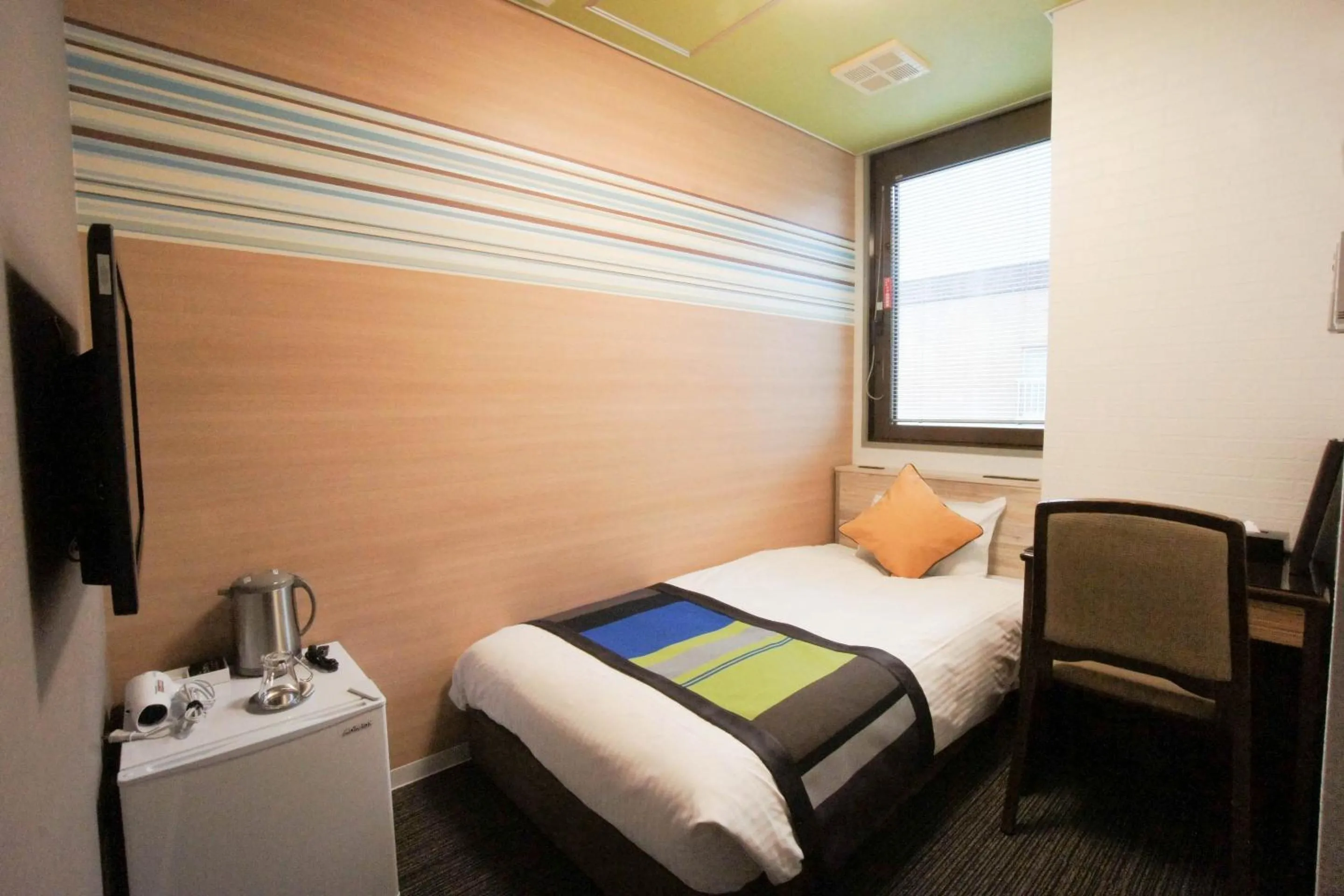 Bed in Hotel AreaOne Nobeoka