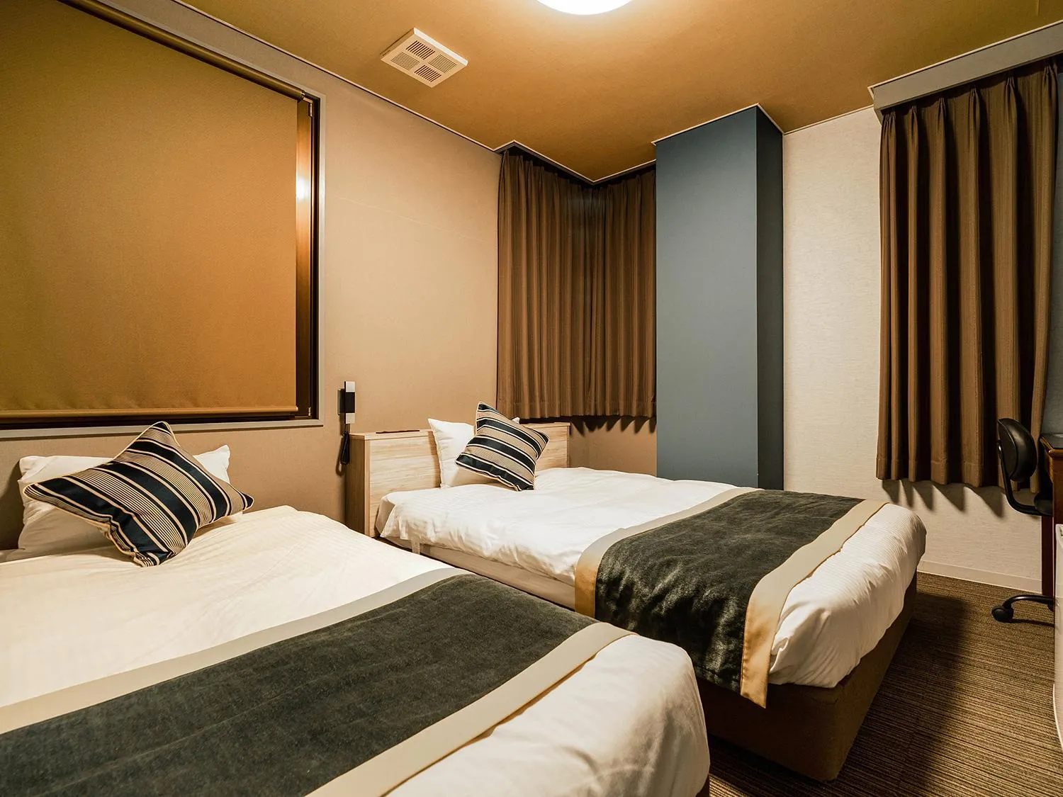 Bed in Hotel AreaOne Nobeoka