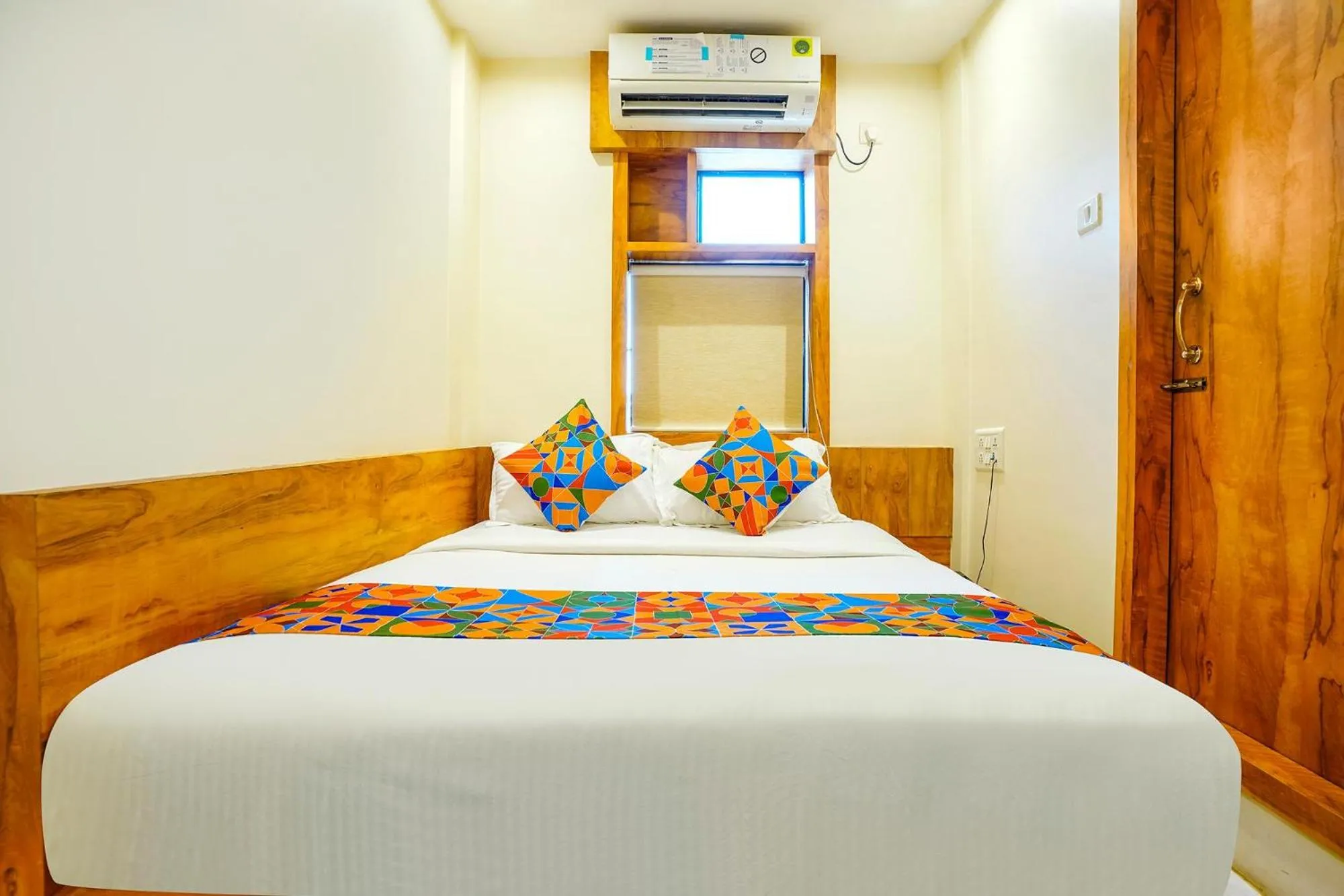 Bed in FabHotel Indore Palace