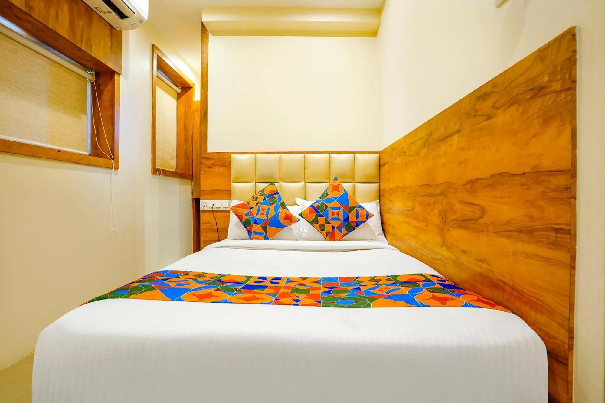 Bed in FabHotel Indore Palace