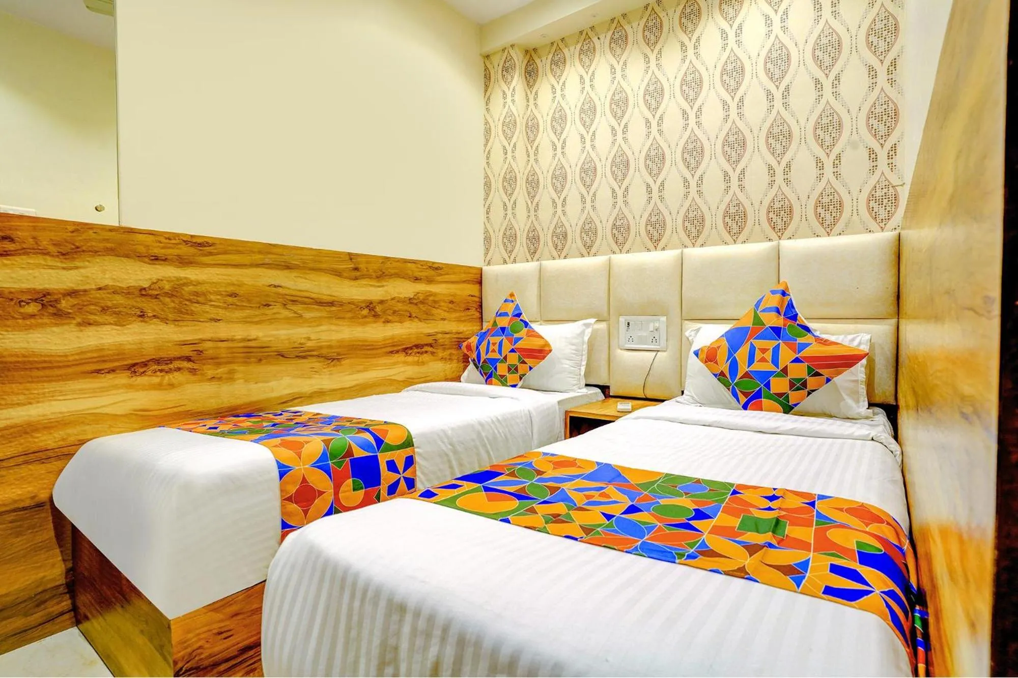 Bed in FabHotel Indore Palace