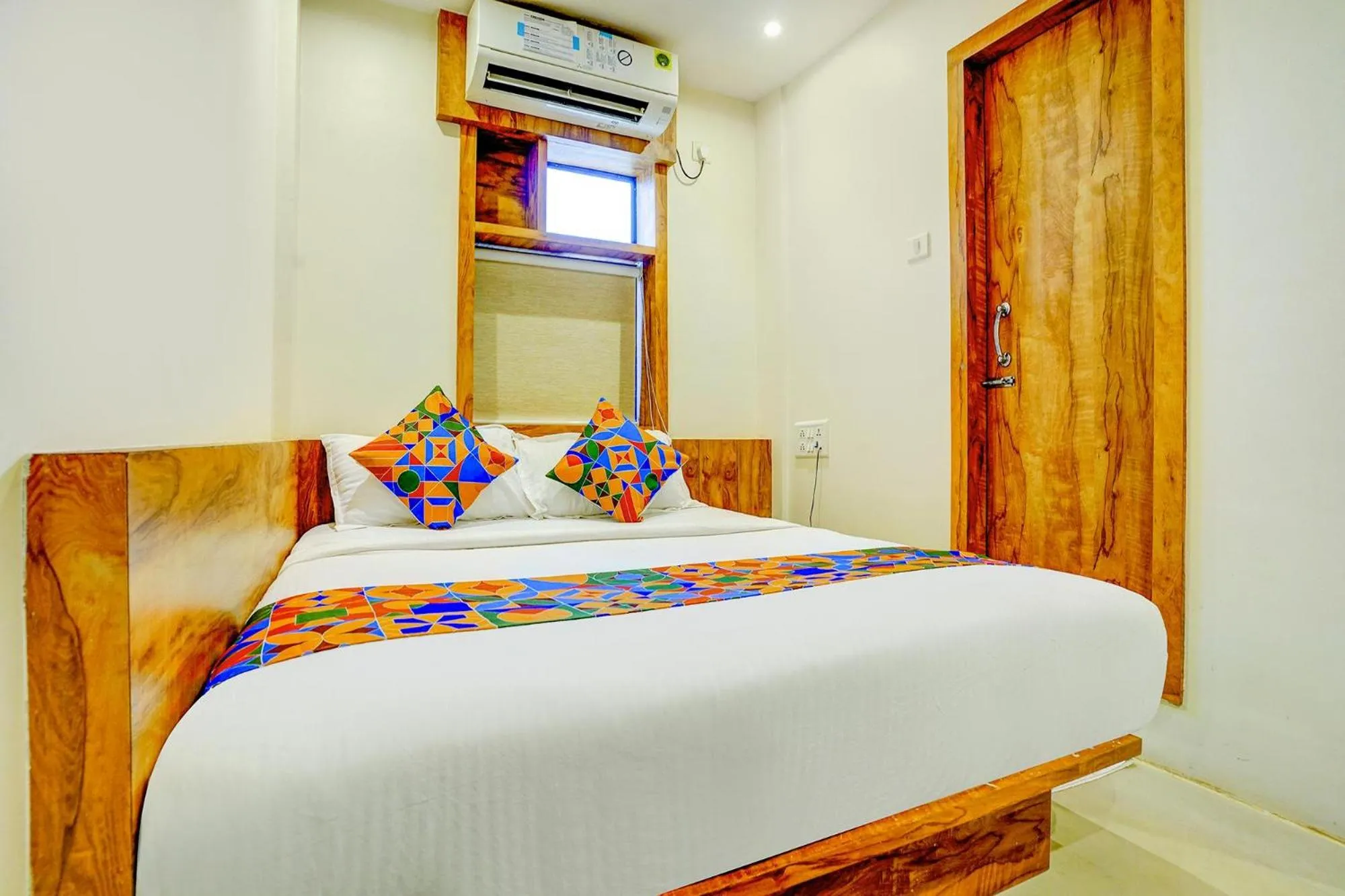 Bed in FabHotel Indore Palace