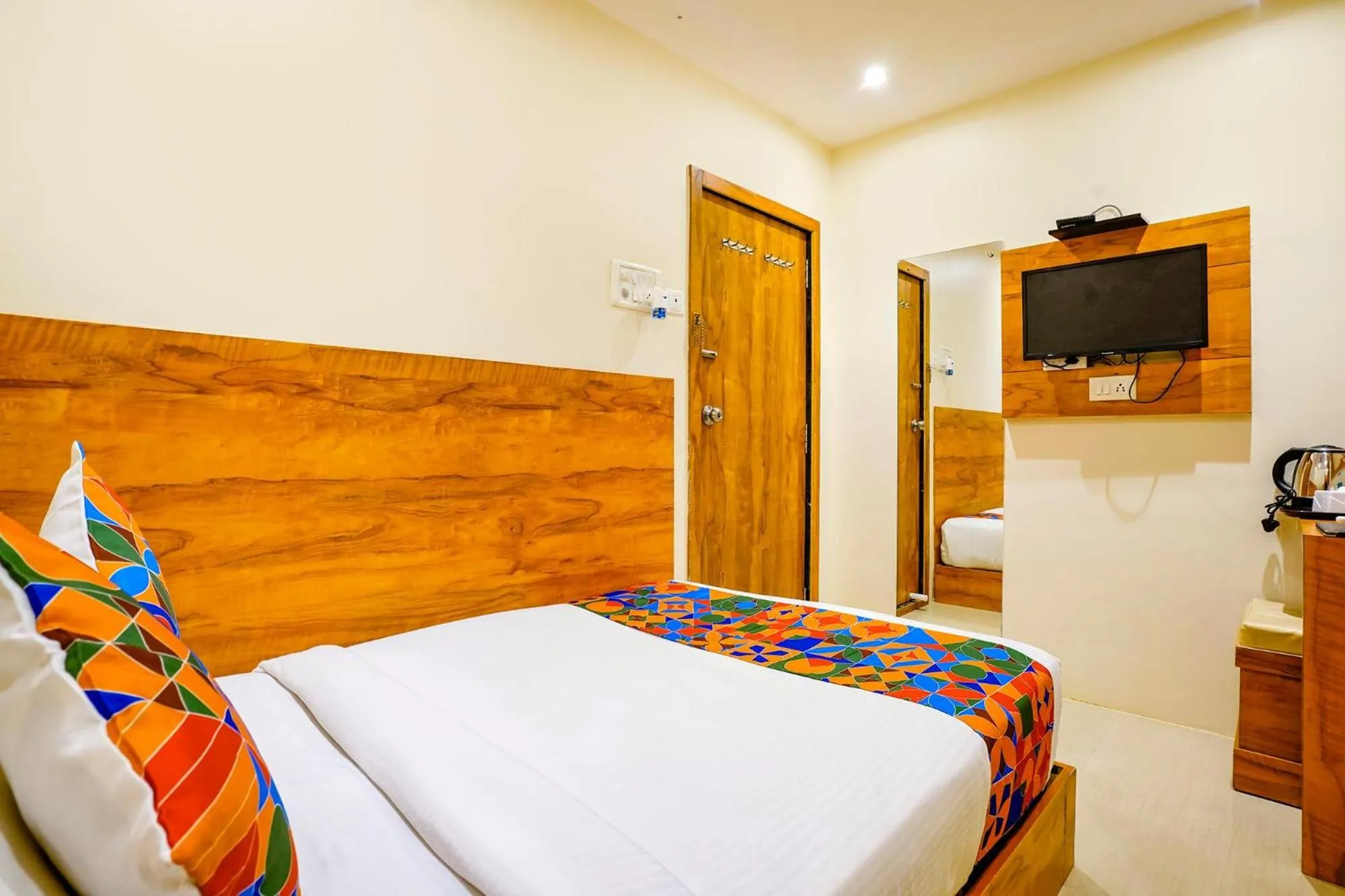 Bed in FabHotel Indore Palace