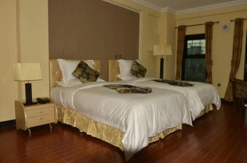 Bed in Afropolitan Hotel