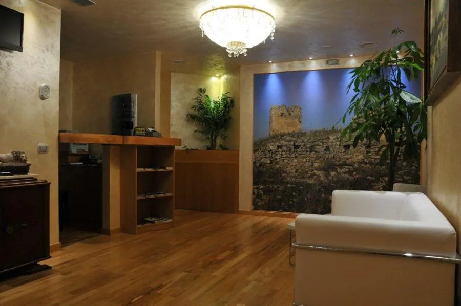 Communal lounge/ TV room in I Rocchi Hotel