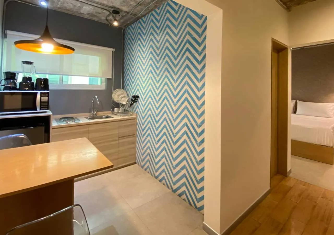 Kitchen or kitchenette, Bed in The Host Business Suites at WTC