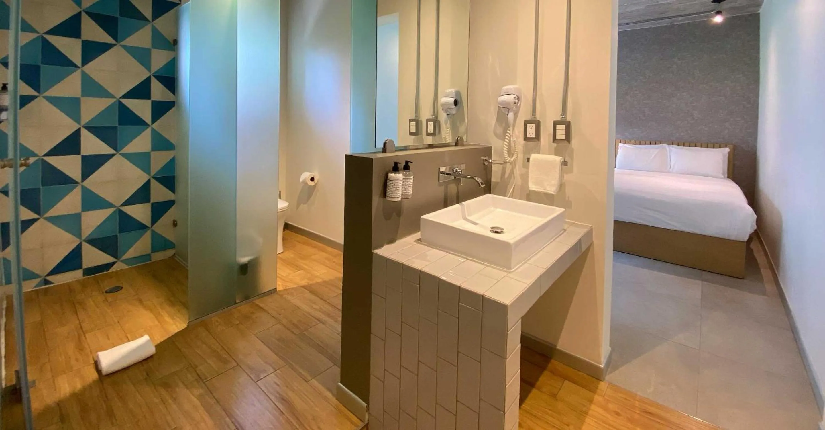 Bathroom, Bed in The Host Business Suites at WTC