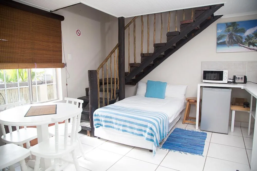 Bed in Ansteys Beach Self Catering Apartments