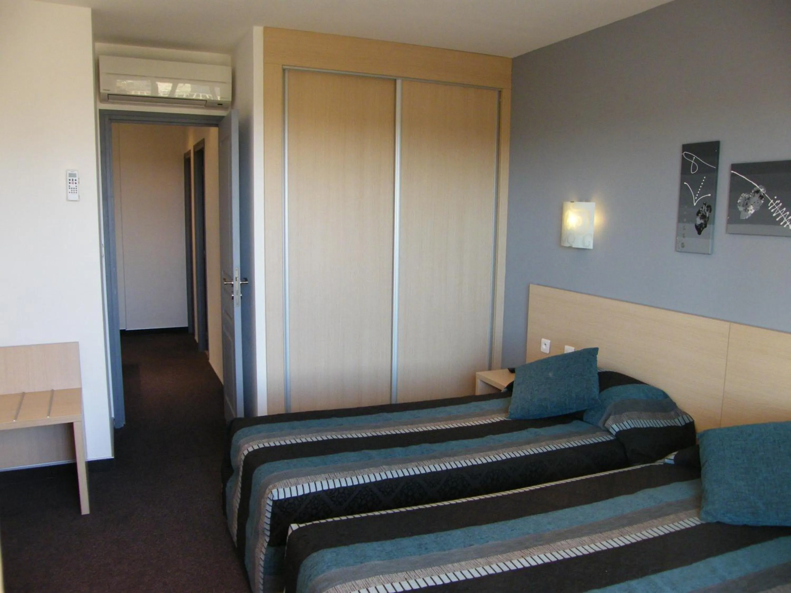 Bedroom in Hôtel Restaurant L' Empereur