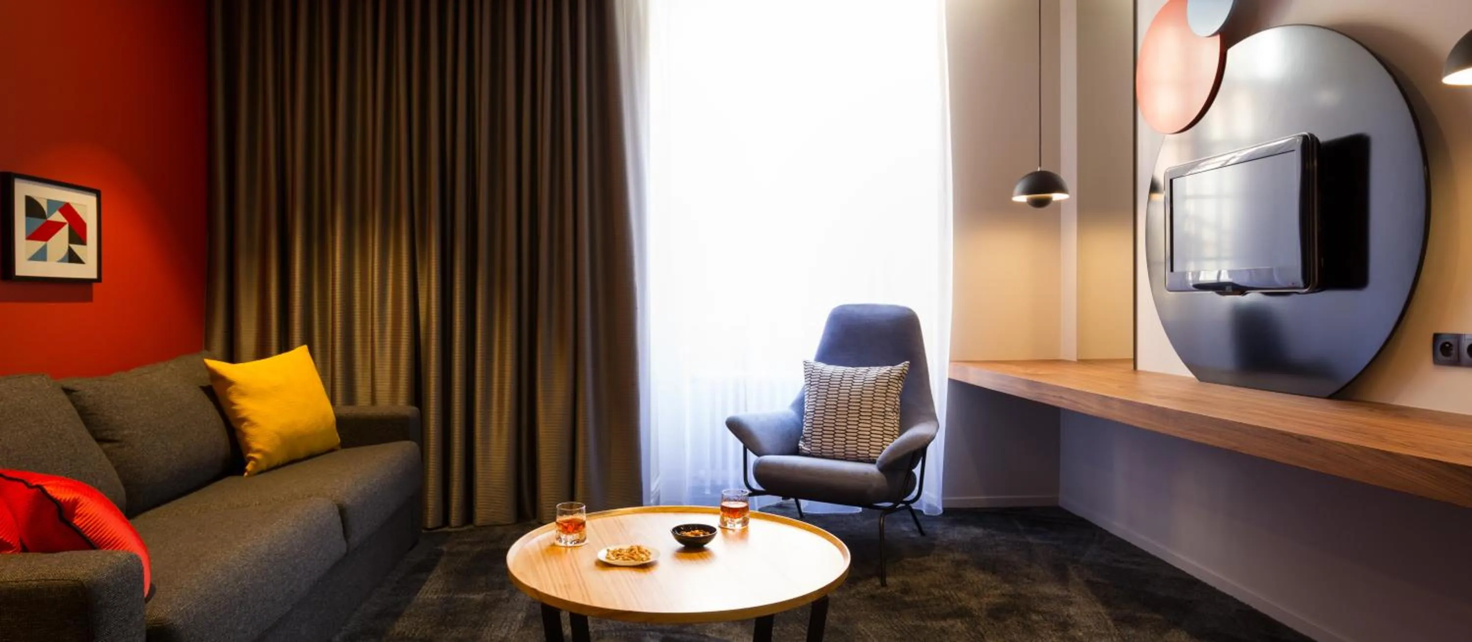 Living room in Chapeau Rouge par William Frachot - Hôtel Espace Bien-être & Restaurant étoilé