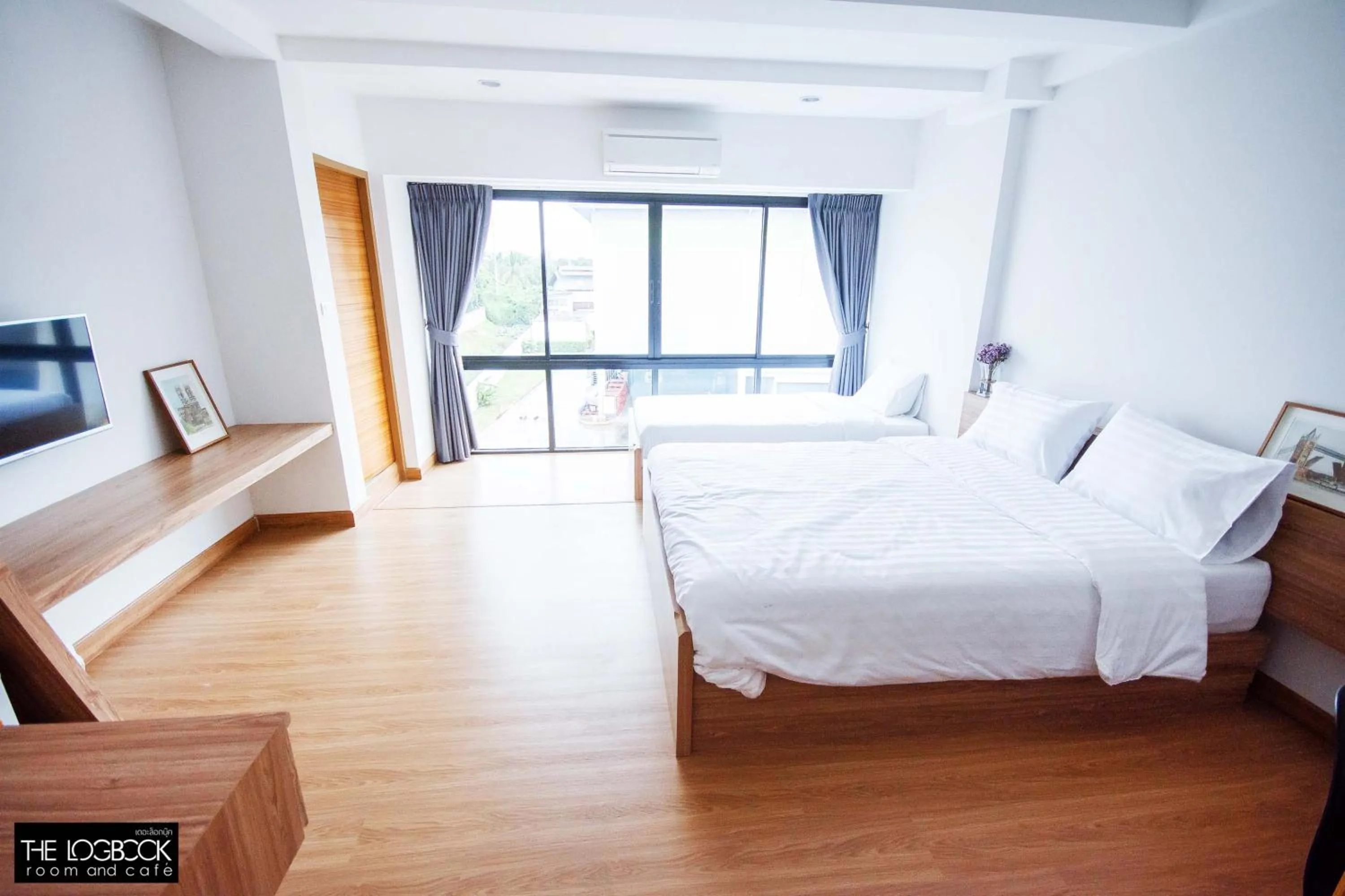 Staff, Bed in The LogBook Room and Cafe'