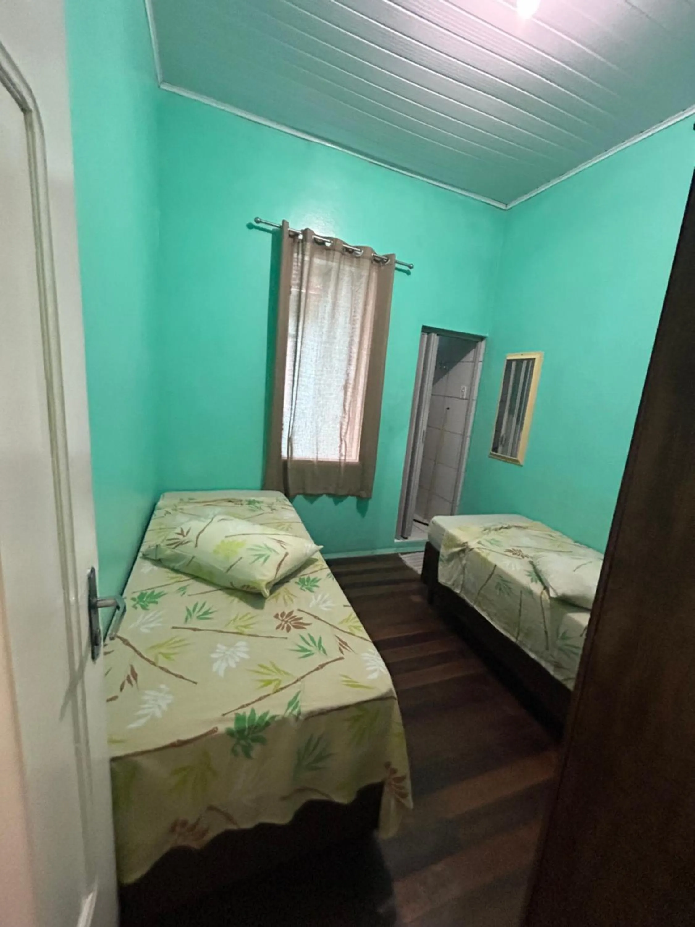 Bed in Pousada Orquidário