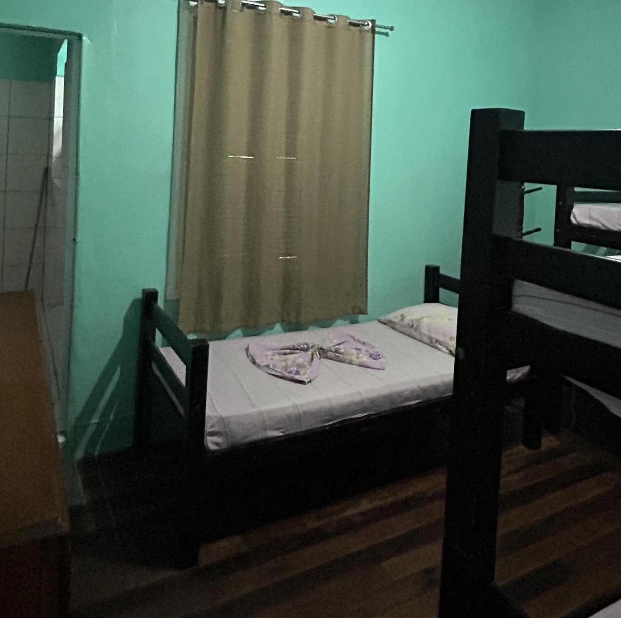 Bed in Pousada Orquidário