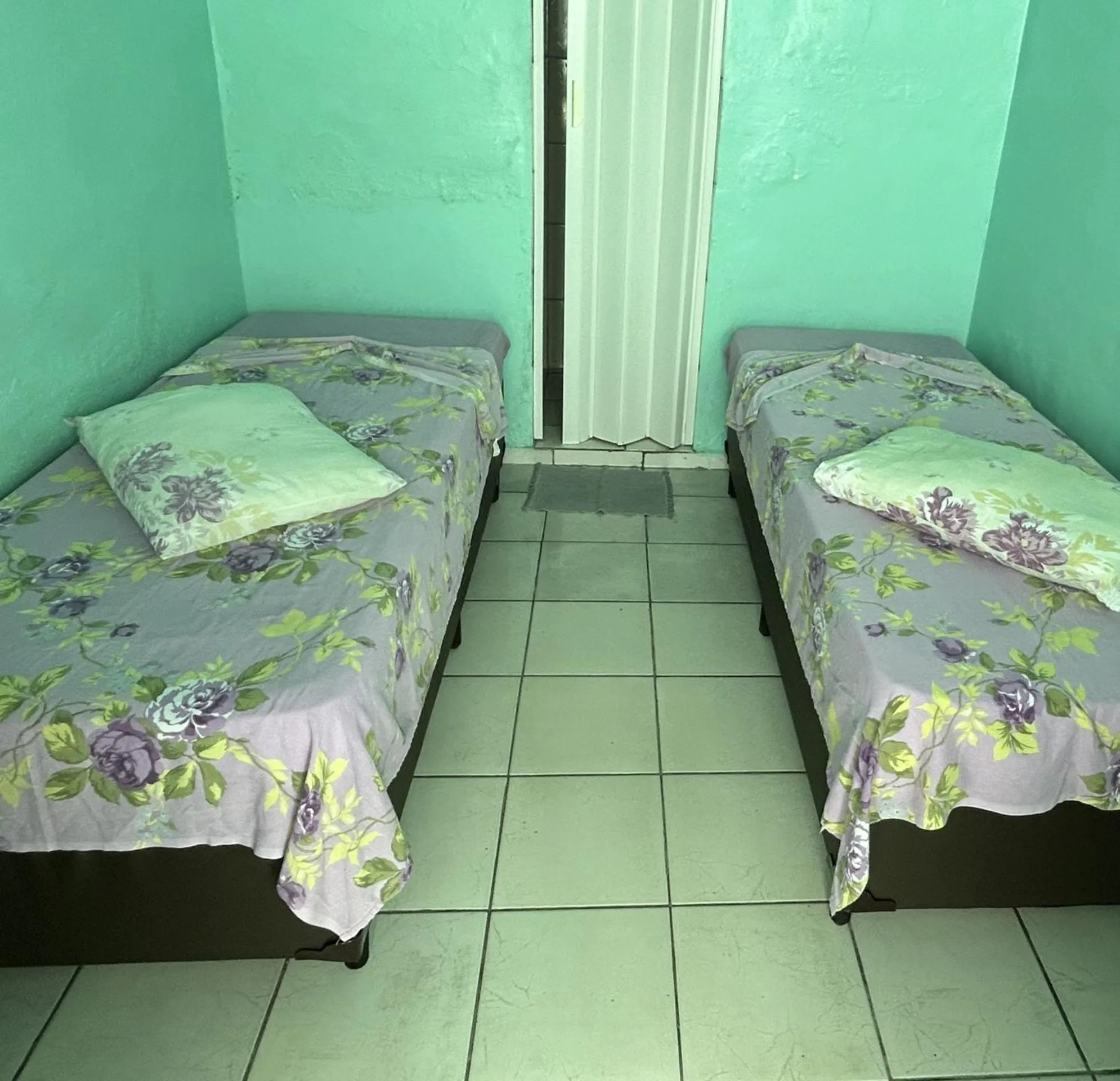 Bed in Pousada Orquidário