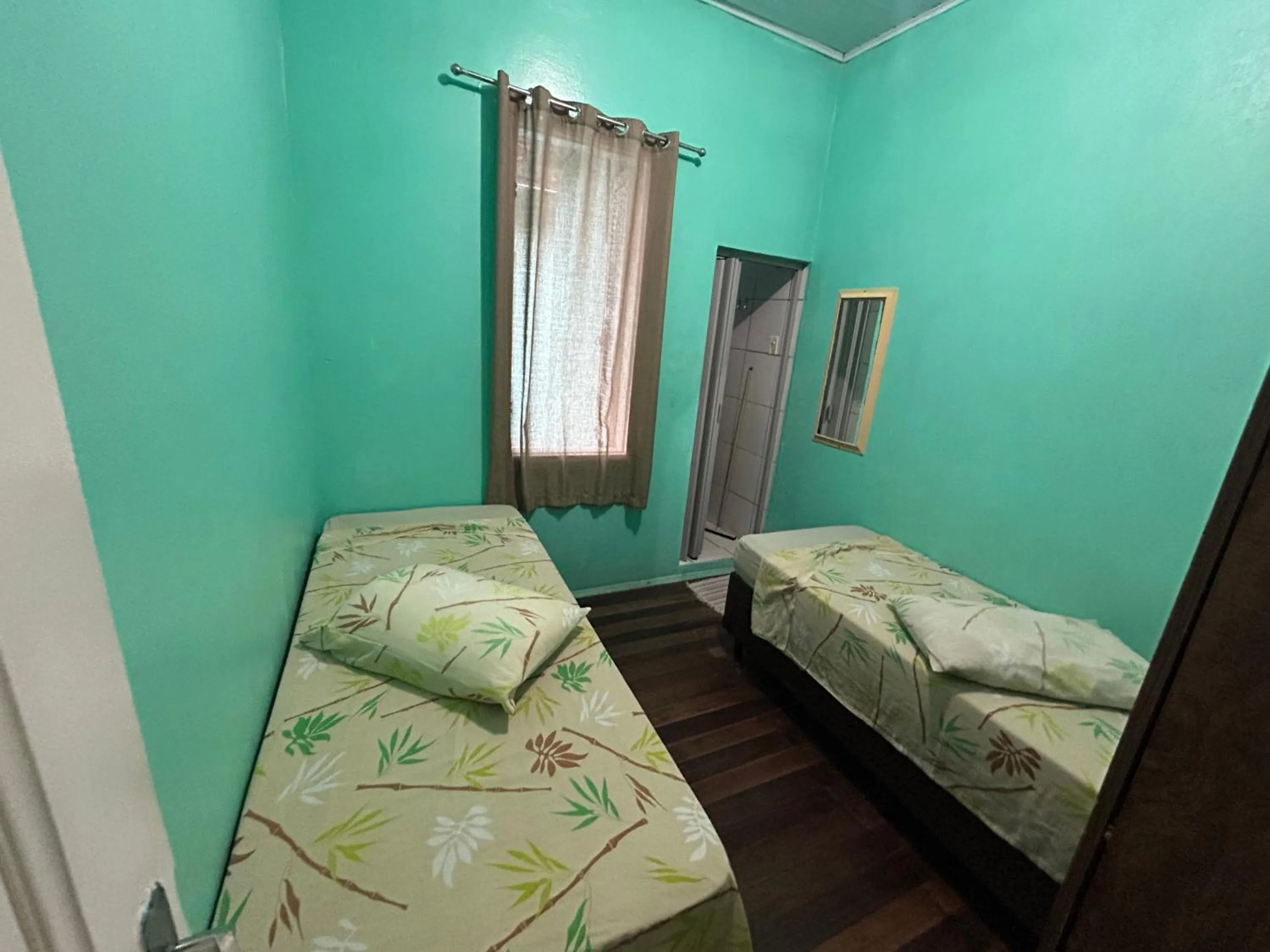 Bed in Pousada Orquidário