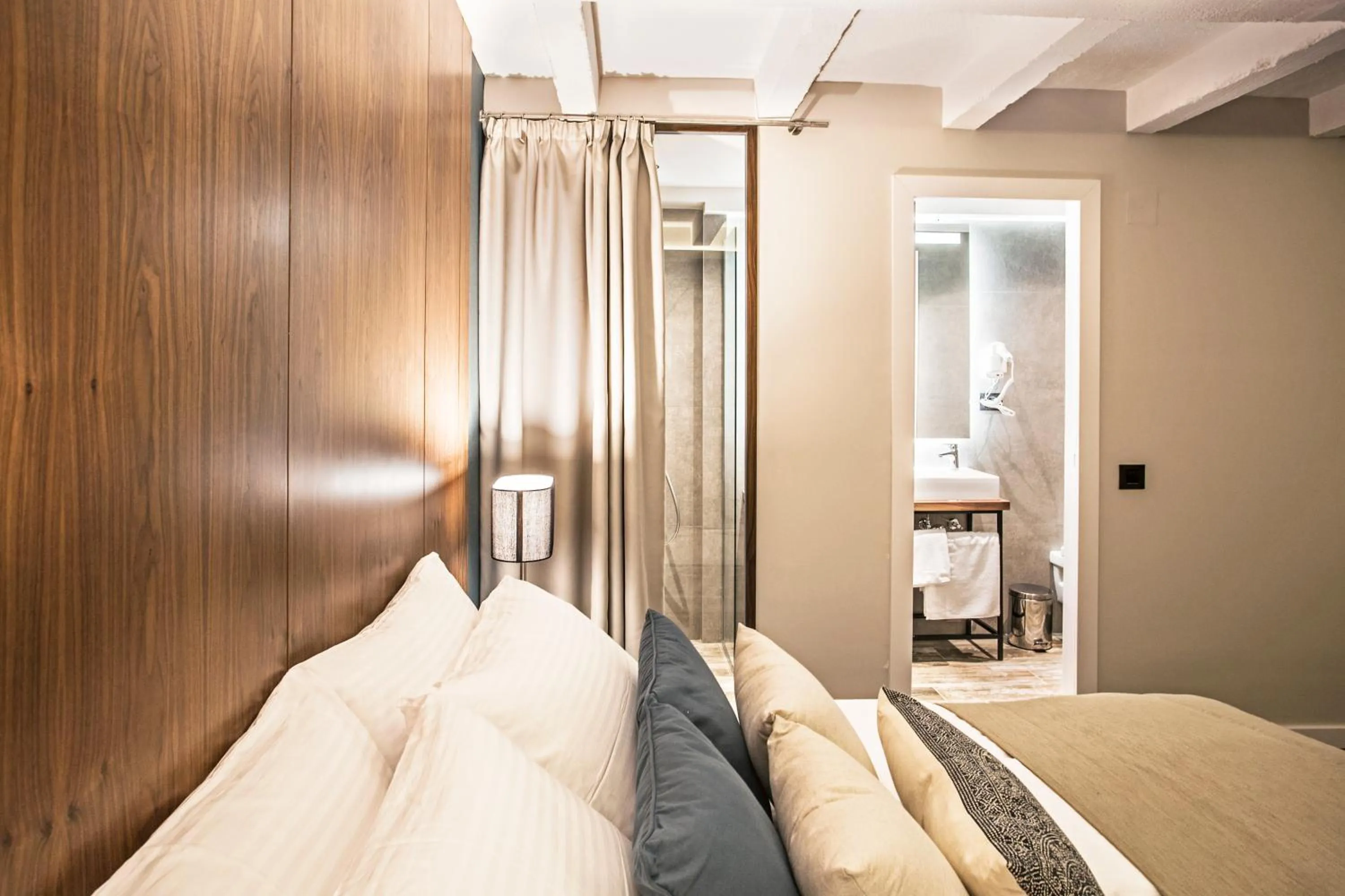 Bed in Nomad Luxury Suites