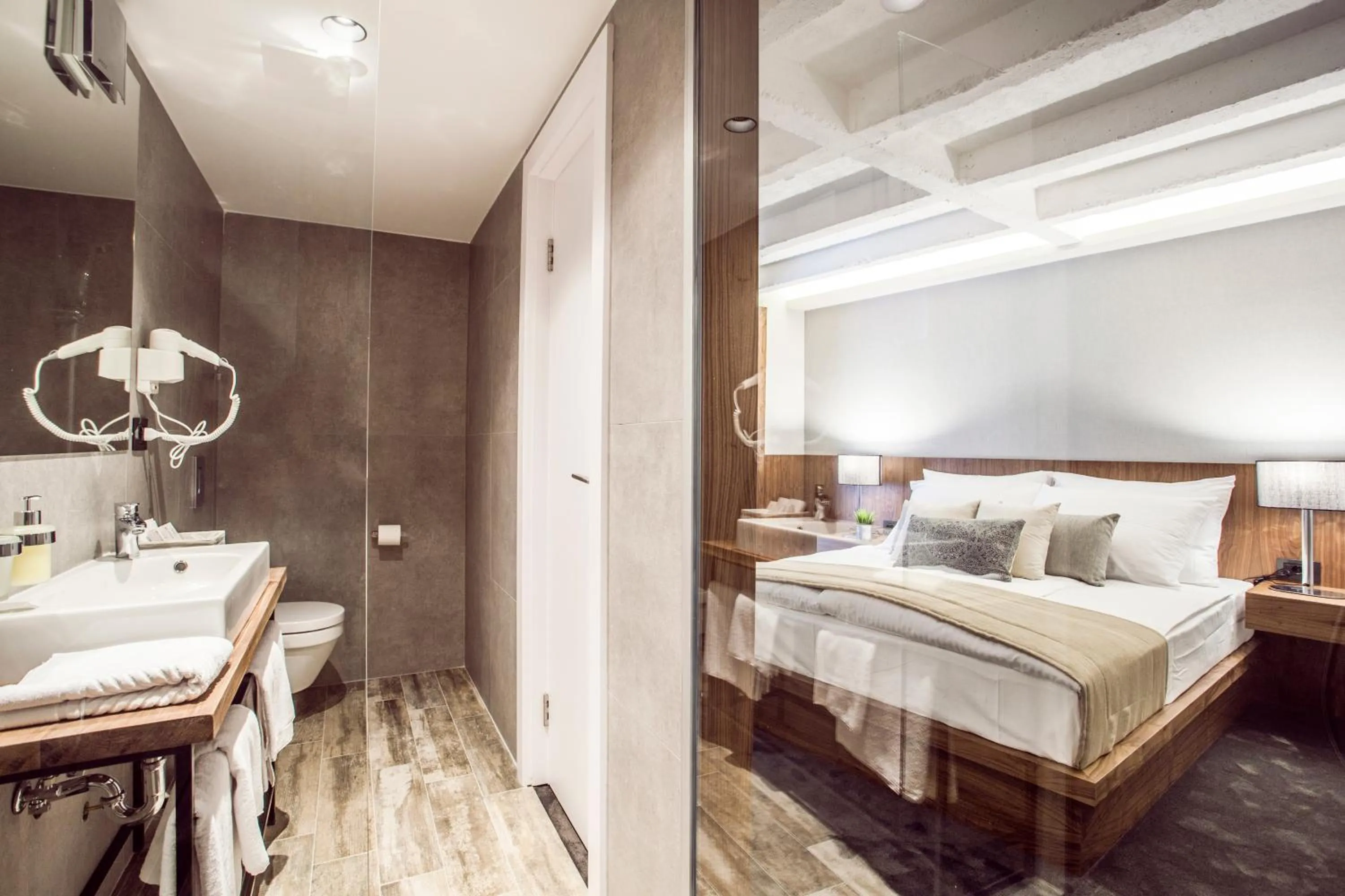 Shower, Bed in Nomad Luxury Suites
