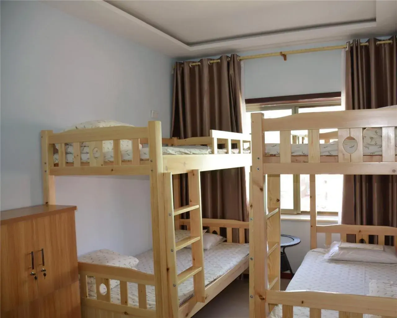 Bed in 4-Bed Male Dormitory Room - air conditioner in The Silk Road Travelers Hostel Bed in 4-Bed Male Dormitory Room - air conditioner in The Silk Road Travelers Hostel