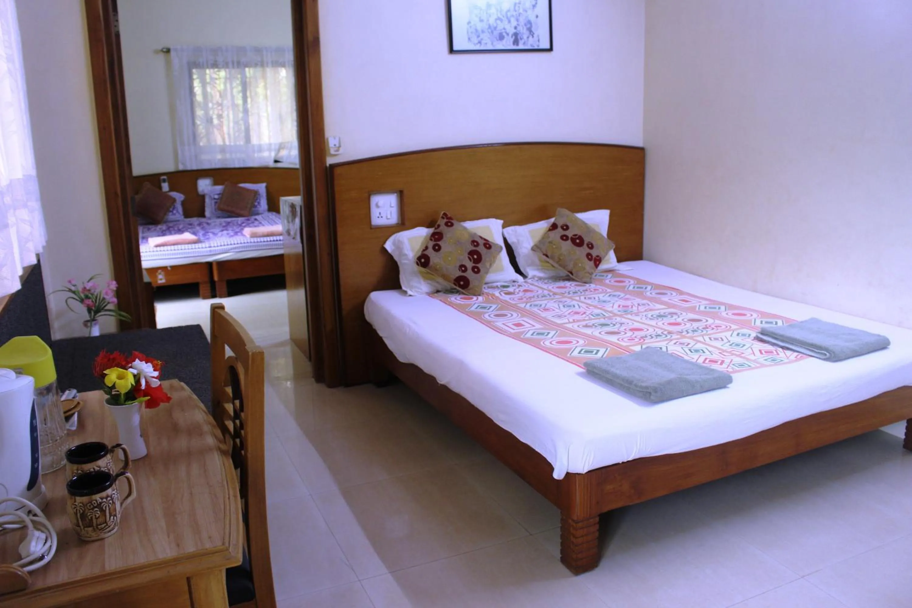 Photo of the whole room, Bed in Mama Mids Home