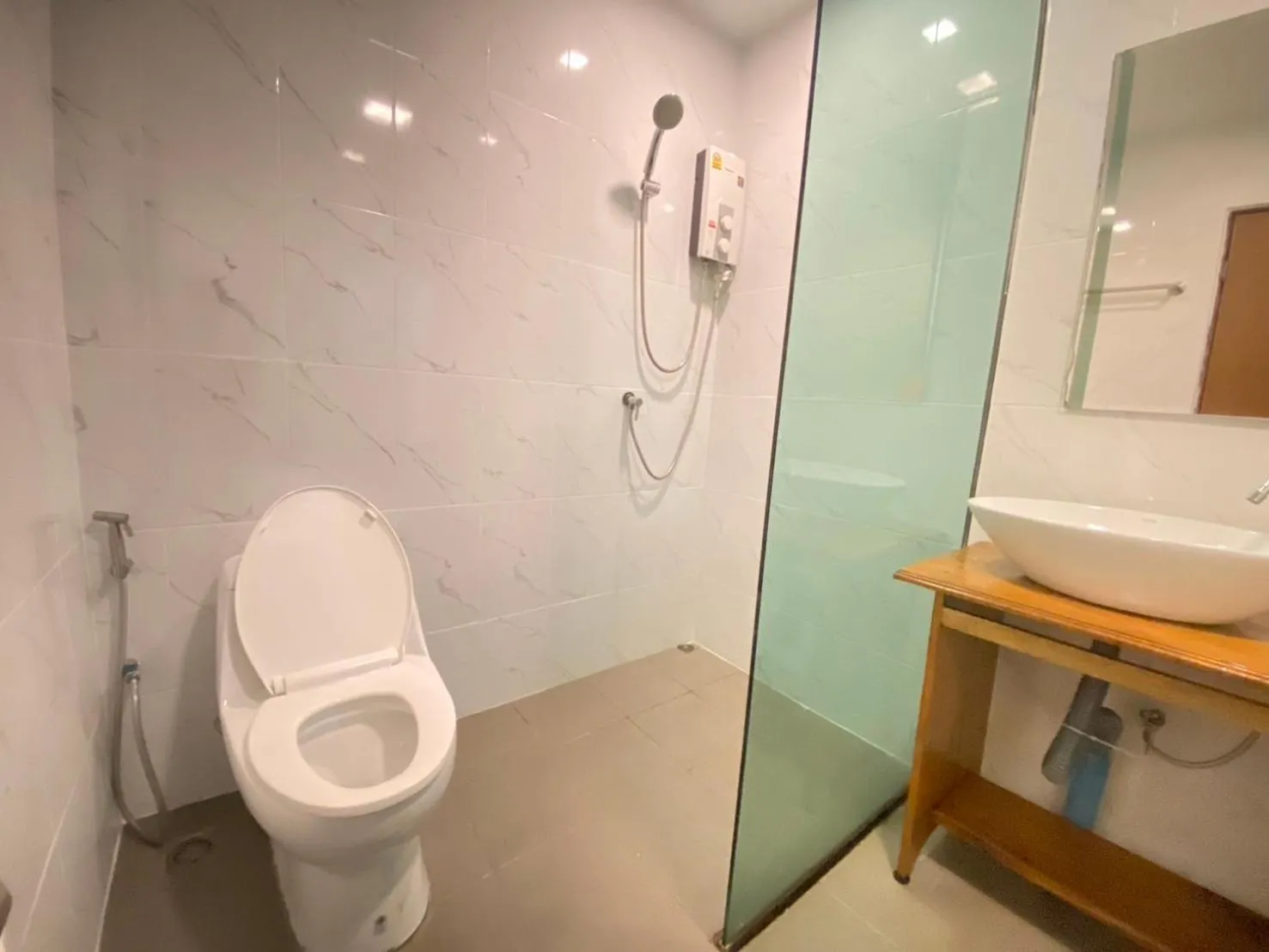 Shower in A Plus Deluxe Hotel