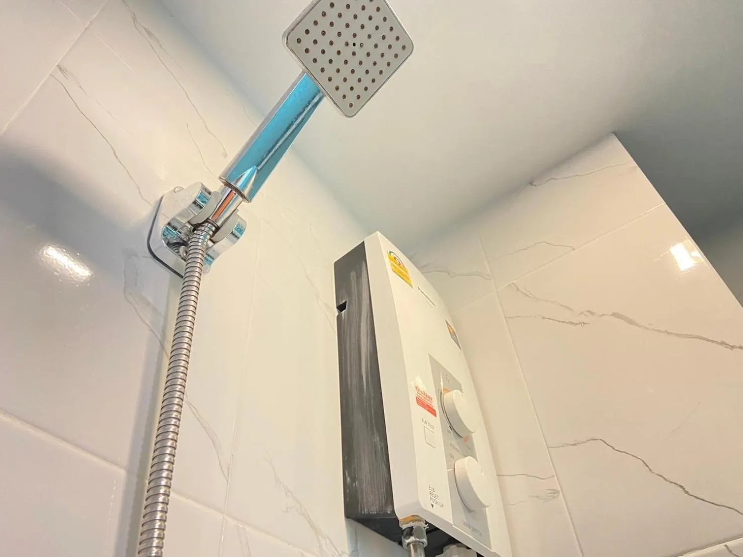 Shower in A Plus Deluxe Hotel