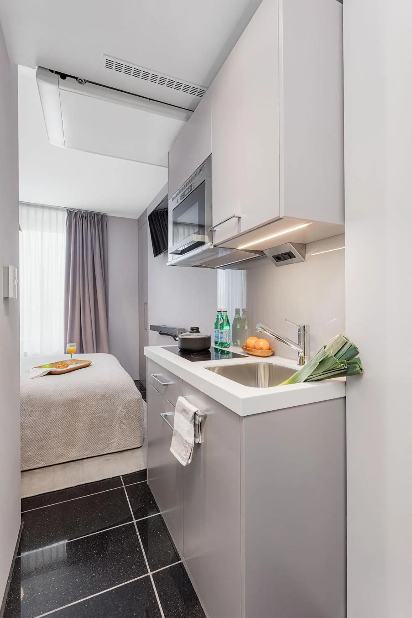 Kitchen or kitchenette, Bed in VISIONAPARTMENTS Lucerne - contactless check-in