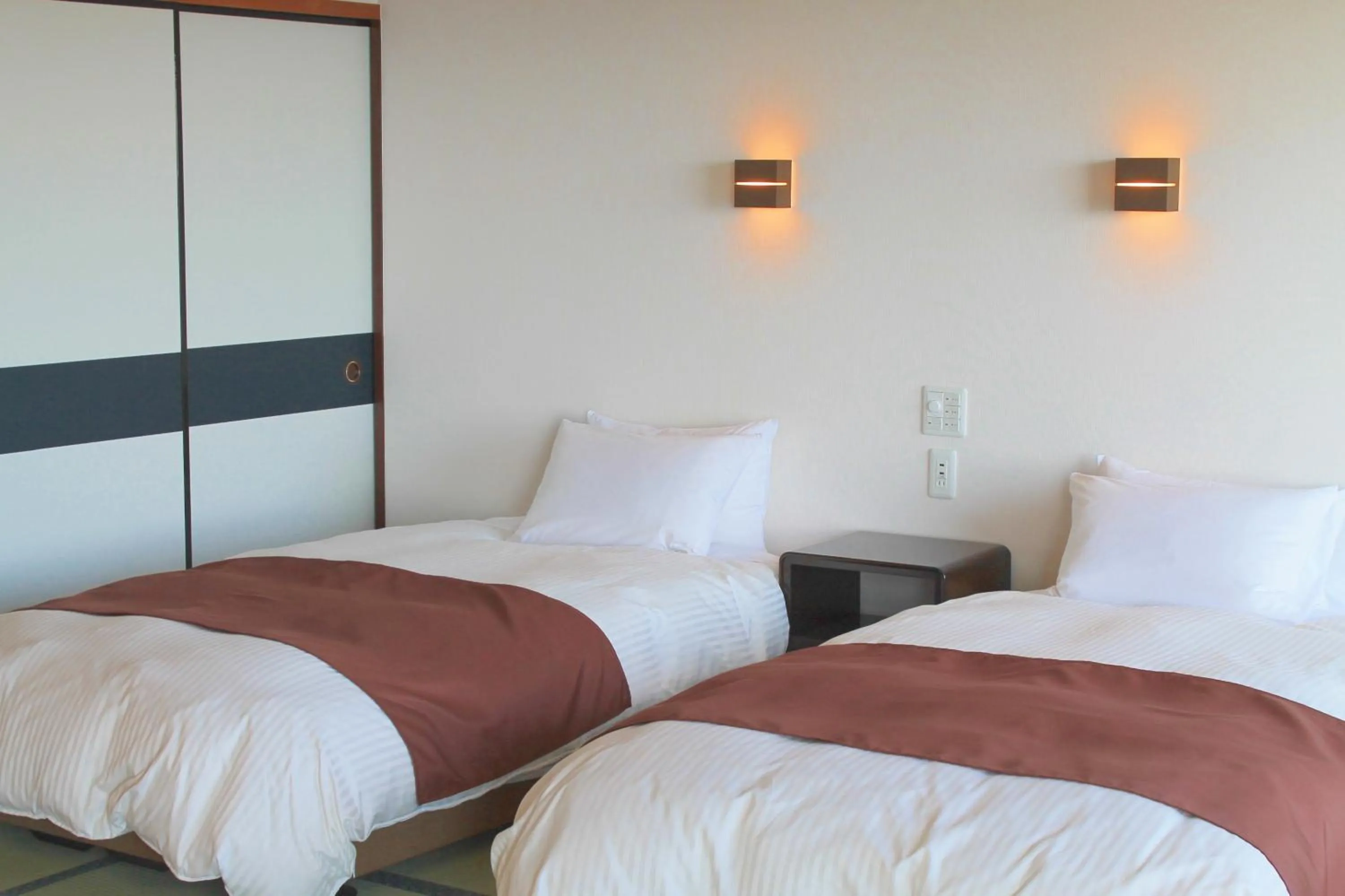 Bed in Ashizuri Kokusai Hotel