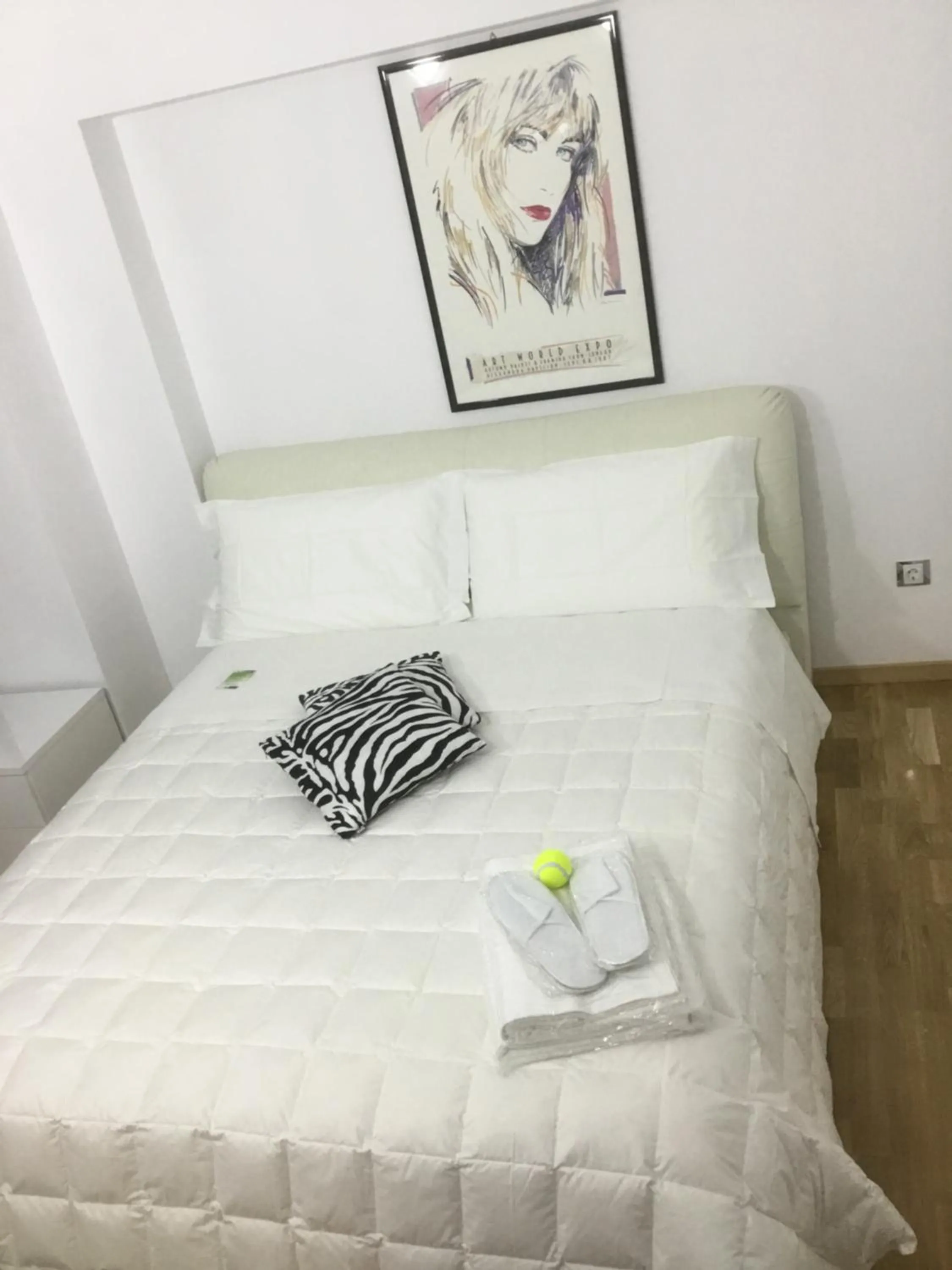 Bed in White Dream Suites