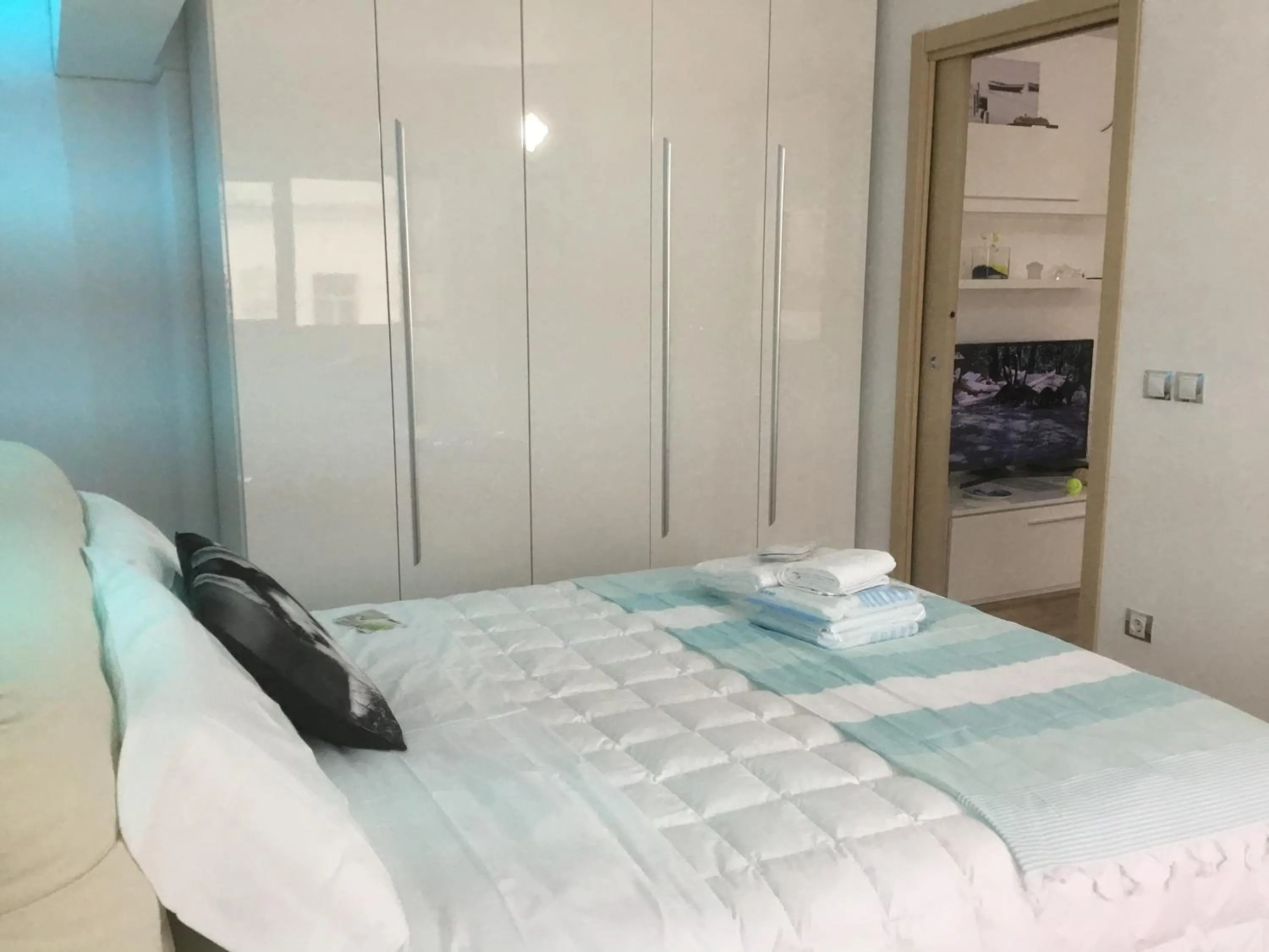 Bed in White Dream Suites