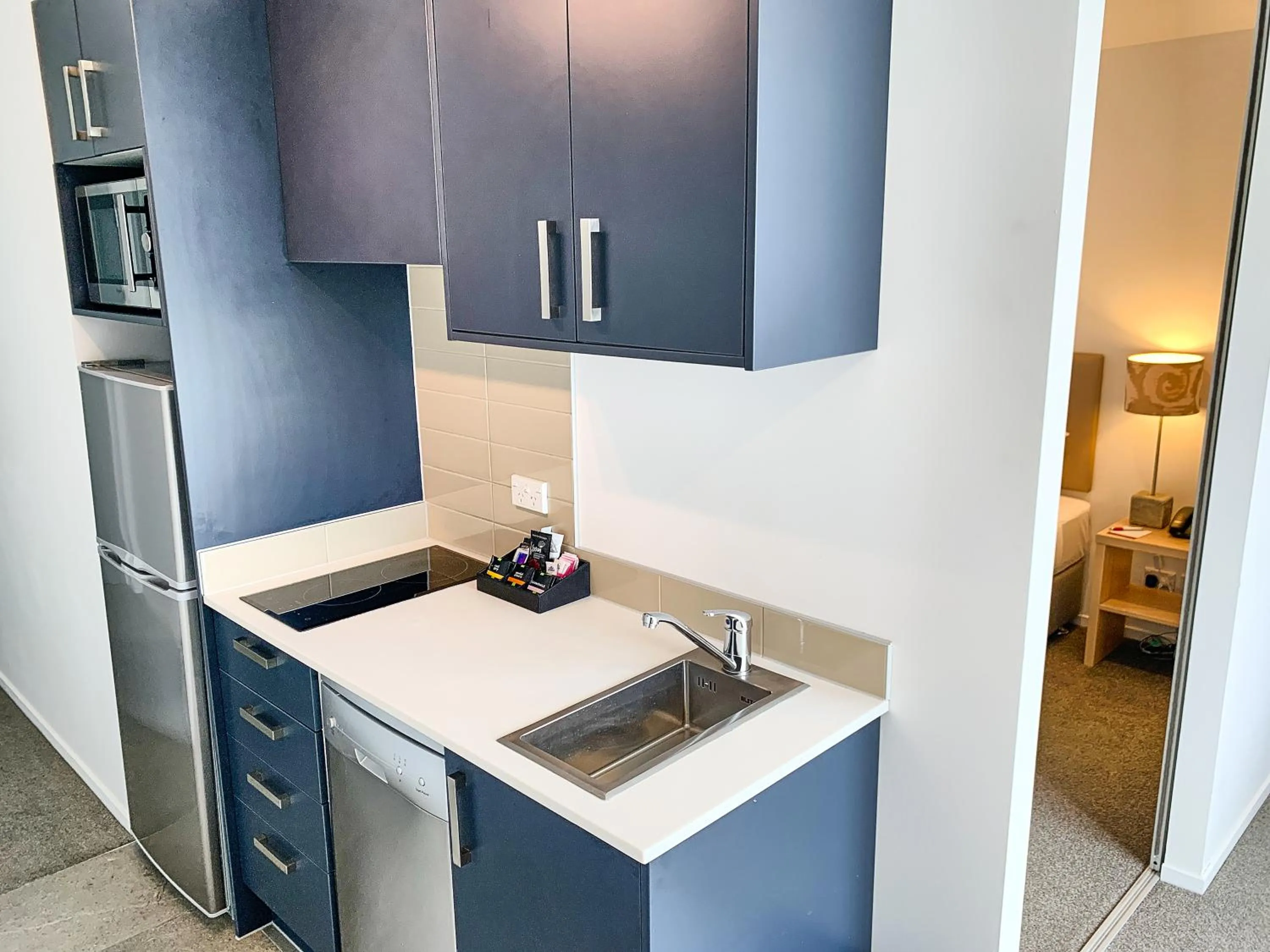 Kitchen or kitchenette in Ramada Suites by Wyndham Albany