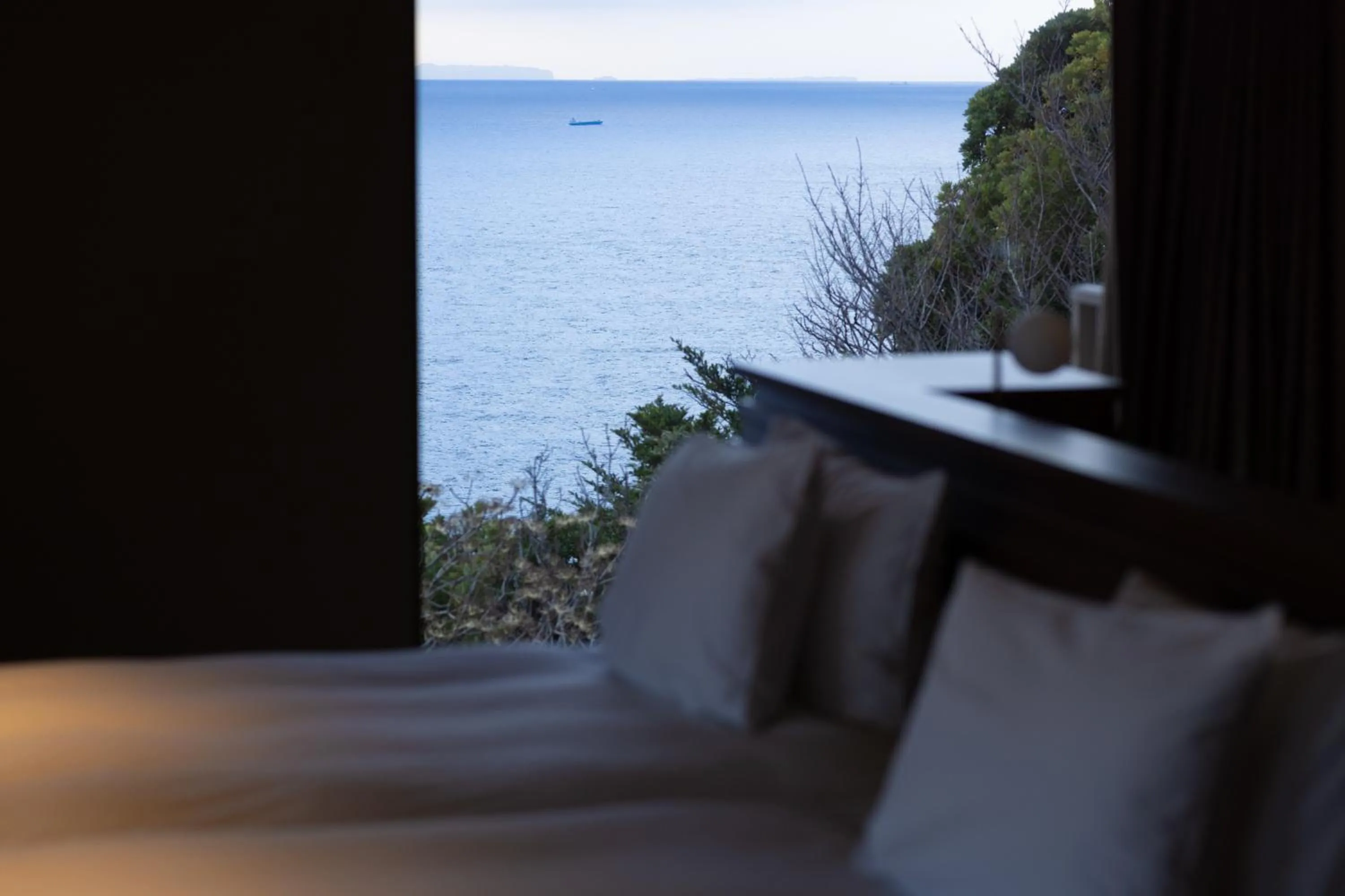Bed in IZU RETREAT by Onko Chishin