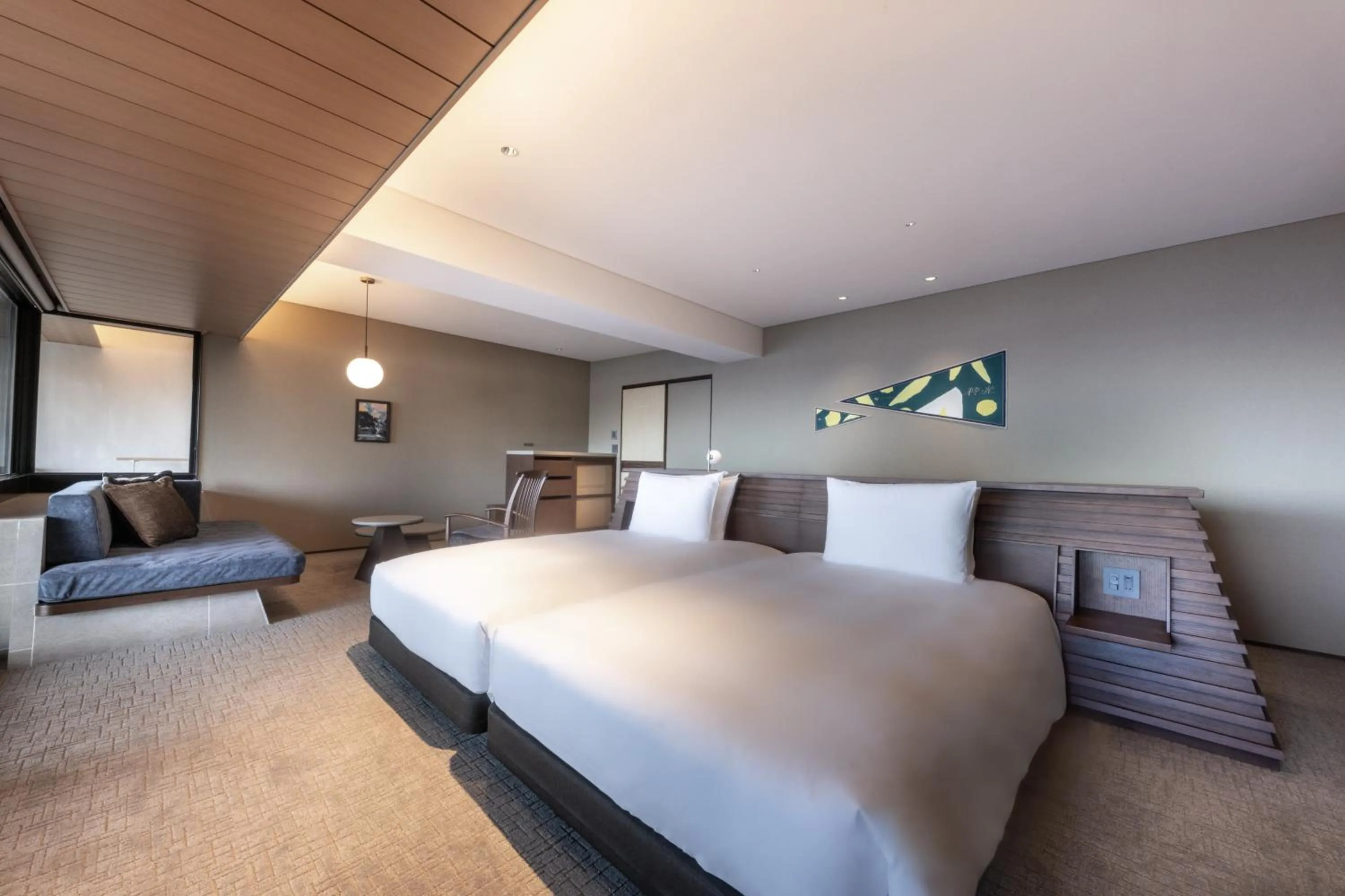 Bed in IZU RETREAT by Onko Chishin