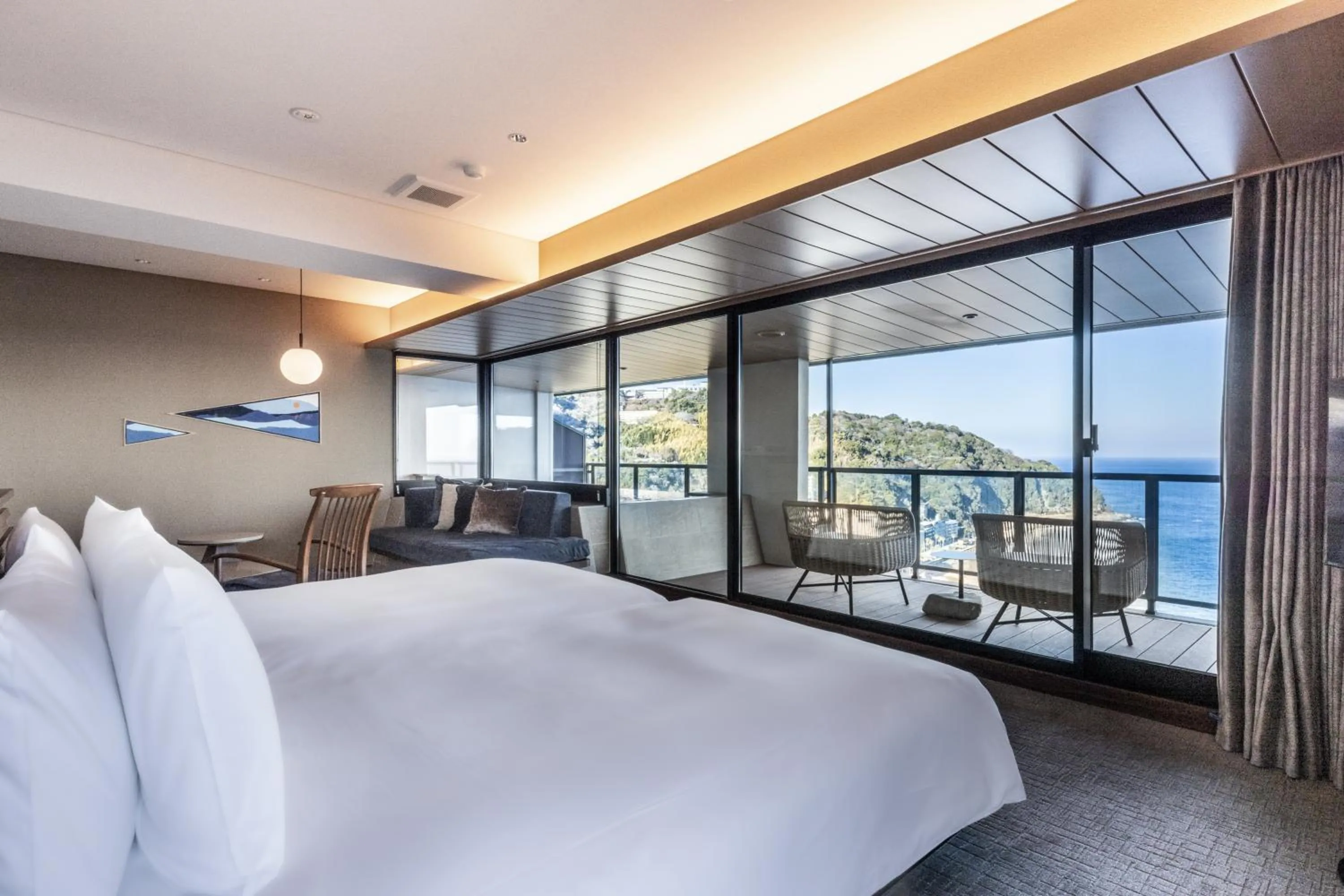 Bed in IZU RETREAT by Onko Chishin