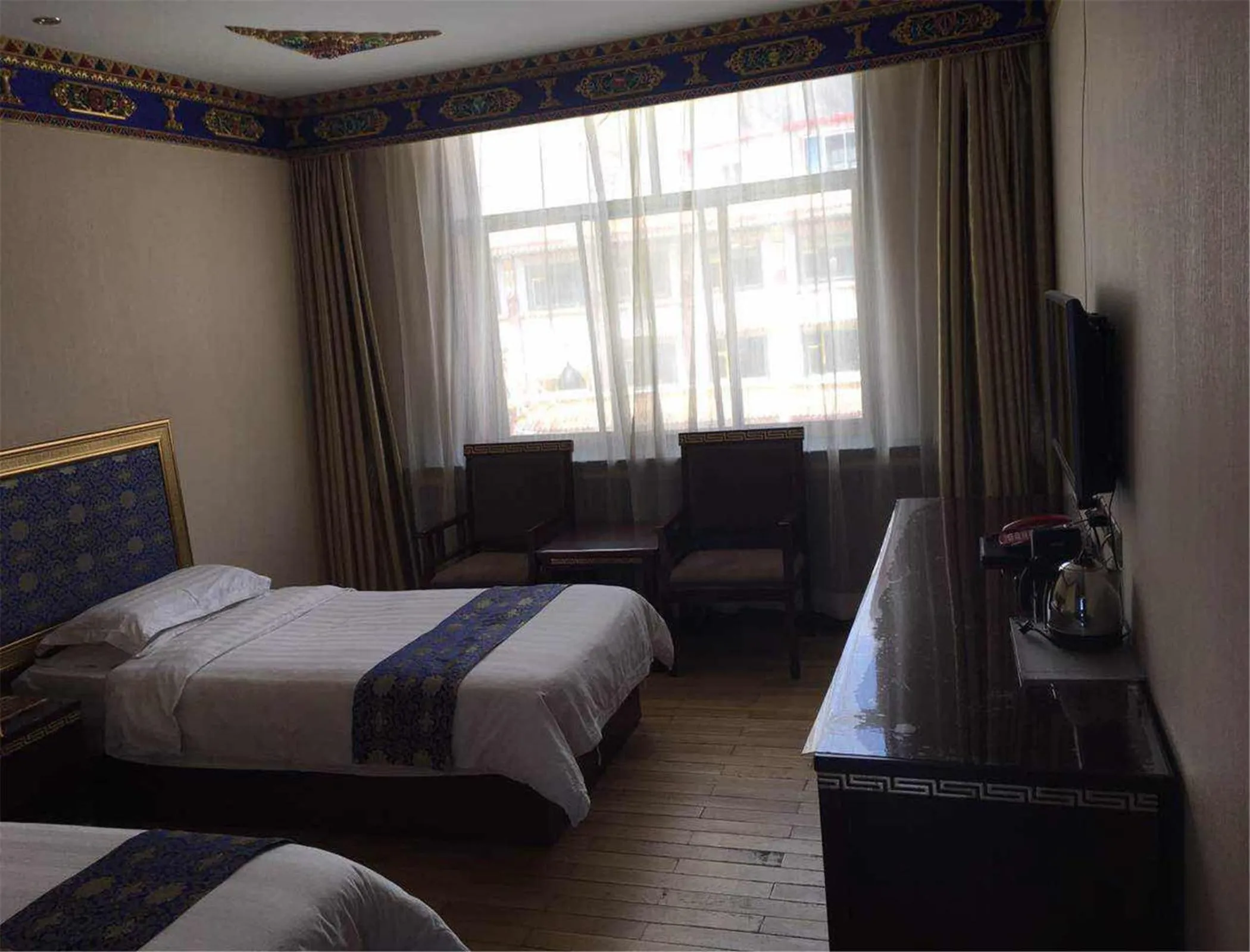 Bed in Overseas Tibetan Hotel