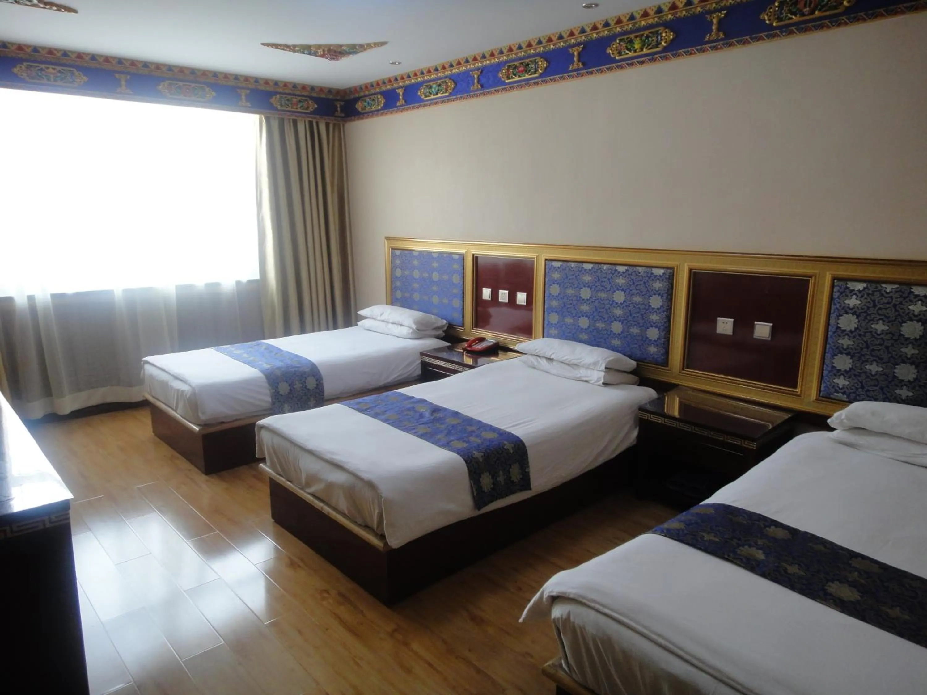 Bed in Overseas Tibetan Hotel