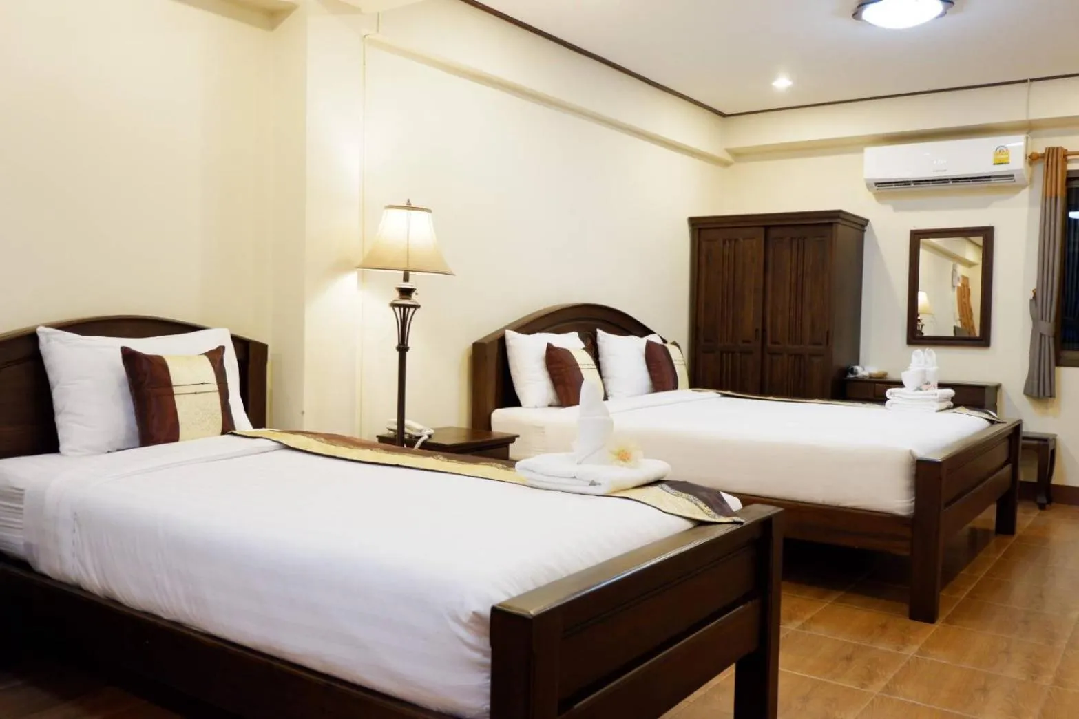 Bed in NanBaanKhun Hotel