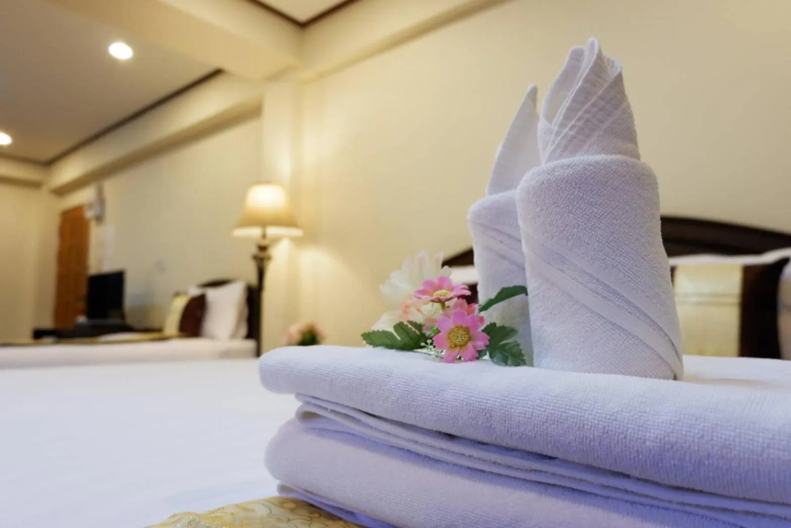 Bed in NanBaanKhun Hotel