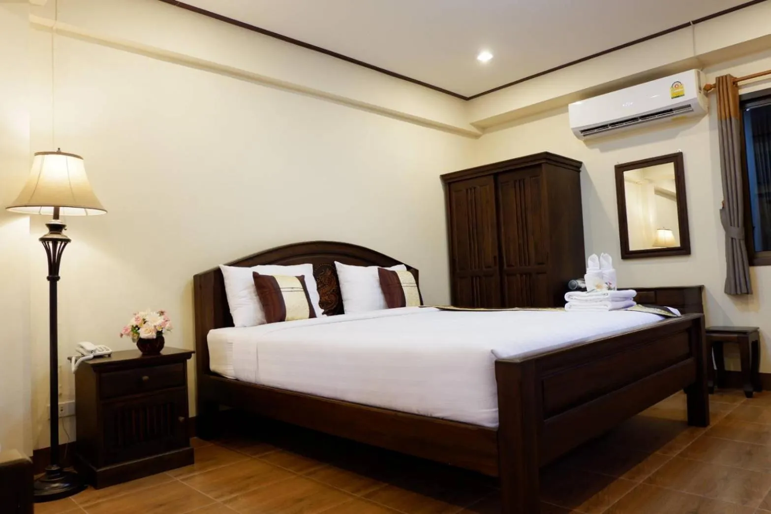 Bed in NanBaanKhun Hotel