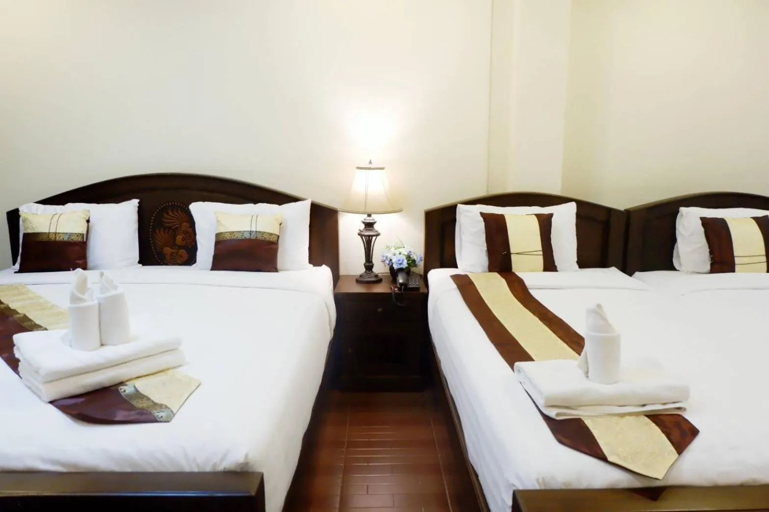 Bed in NanBaanKhun Hotel