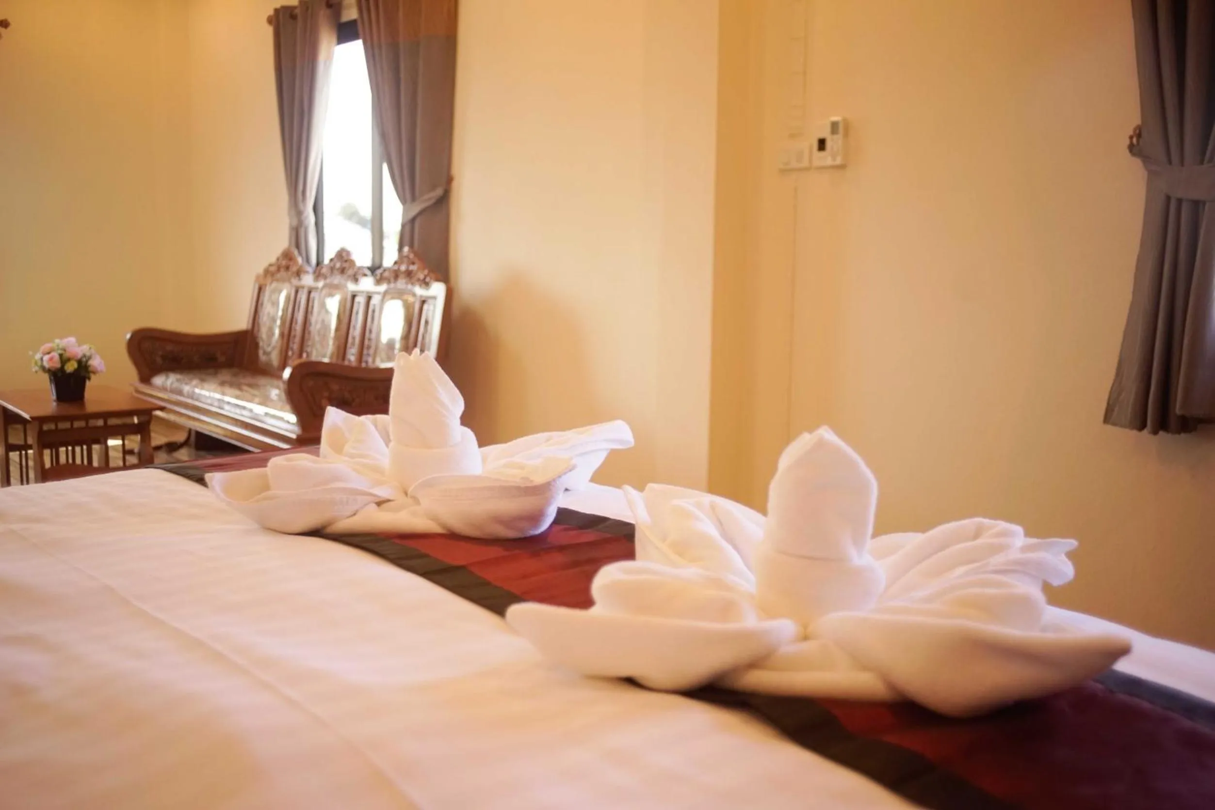 Bed in NanBaanKhun Hotel