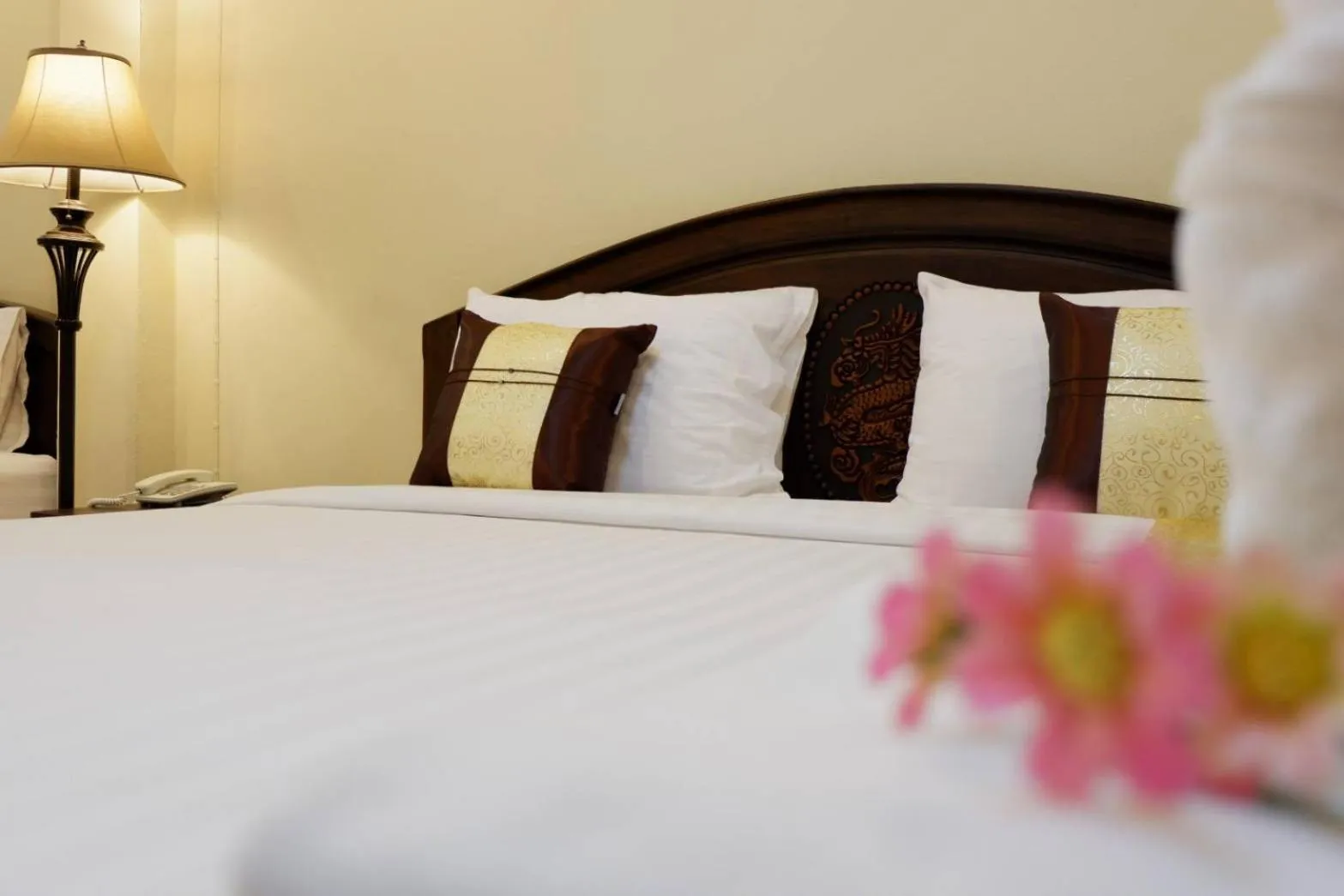 Bed in NanBaanKhun Hotel