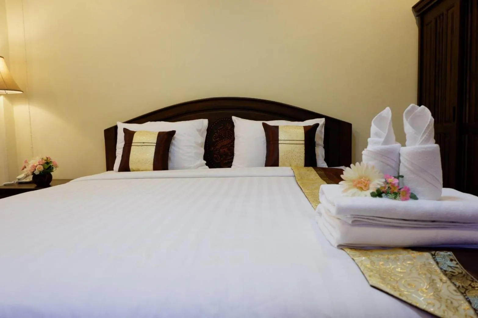 Bed in NanBaanKhun Hotel