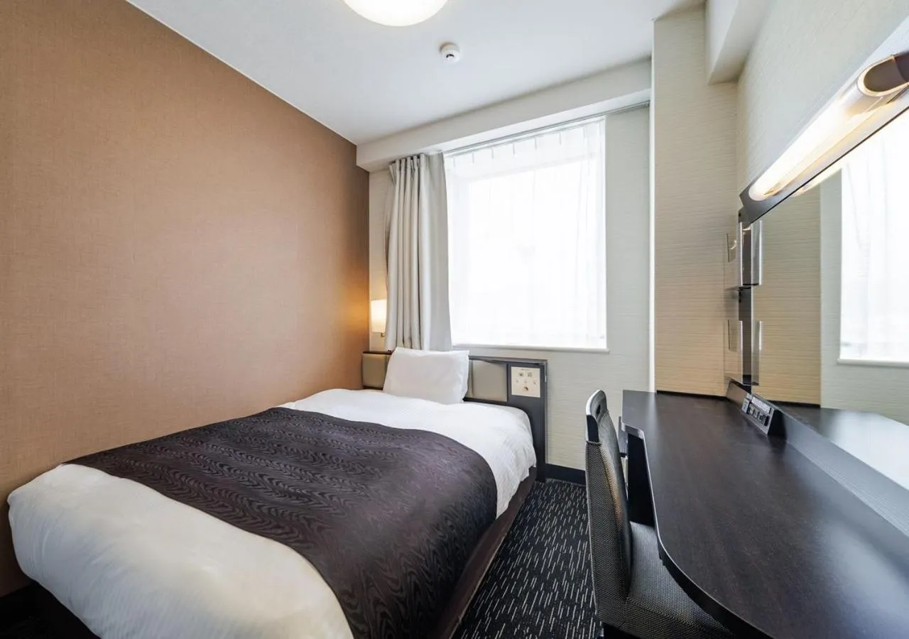 Bed in APA Hotel Miyazaki Nobeoka Chuo