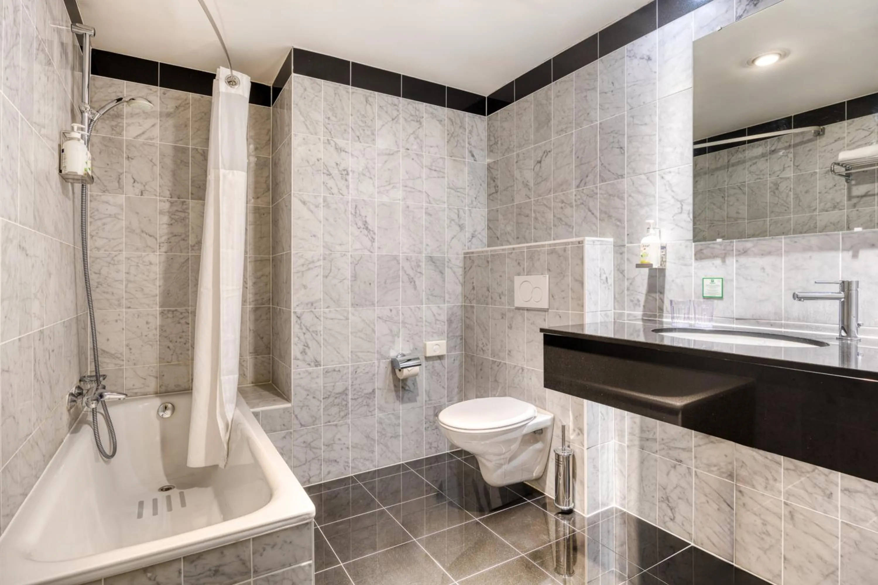 Bathroom in Holiday Inn Brussels Schuman by IHG