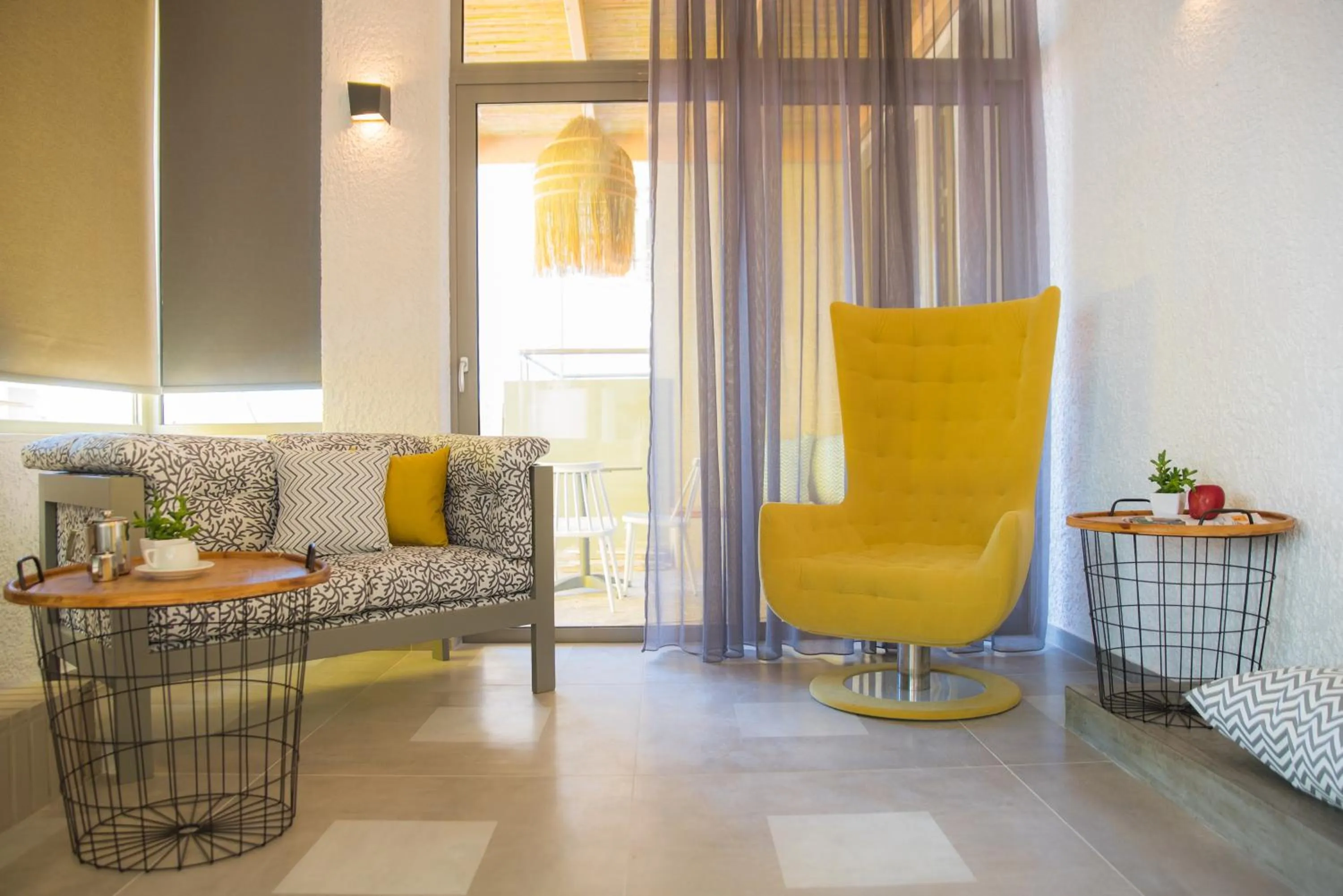 Communal lounge/ TV room in Sunshine Boutique Hotel by Estia