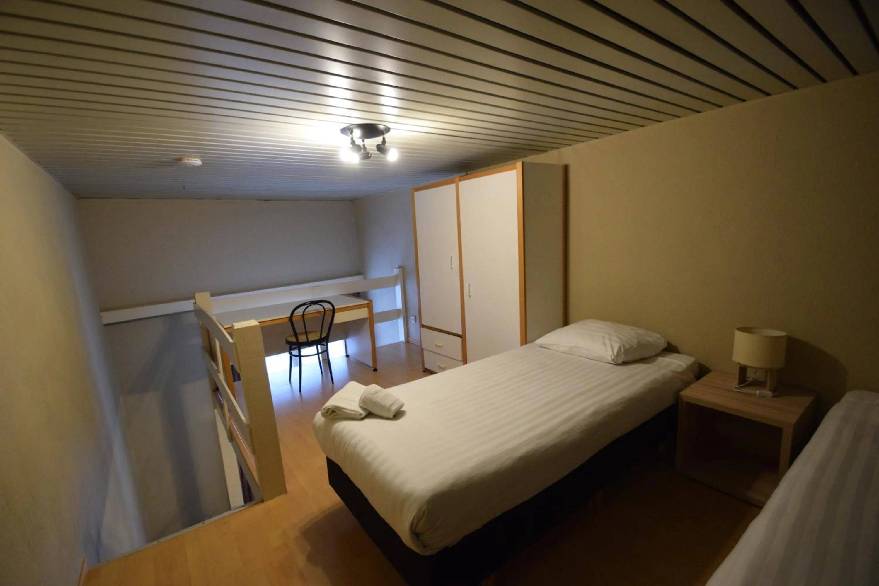 Bed in Condo Gardens Leuven