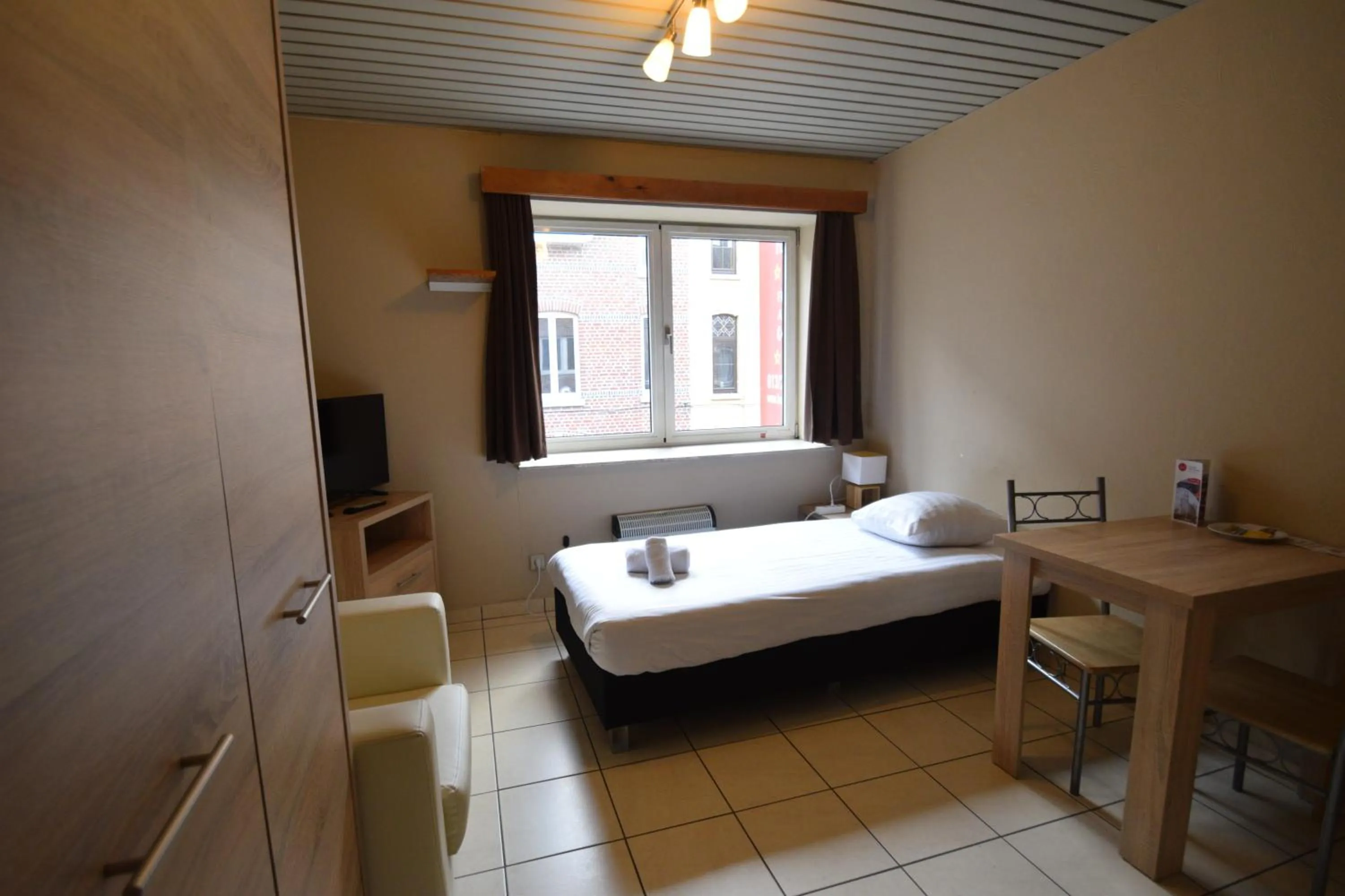 Bed in Condo Gardens Leuven